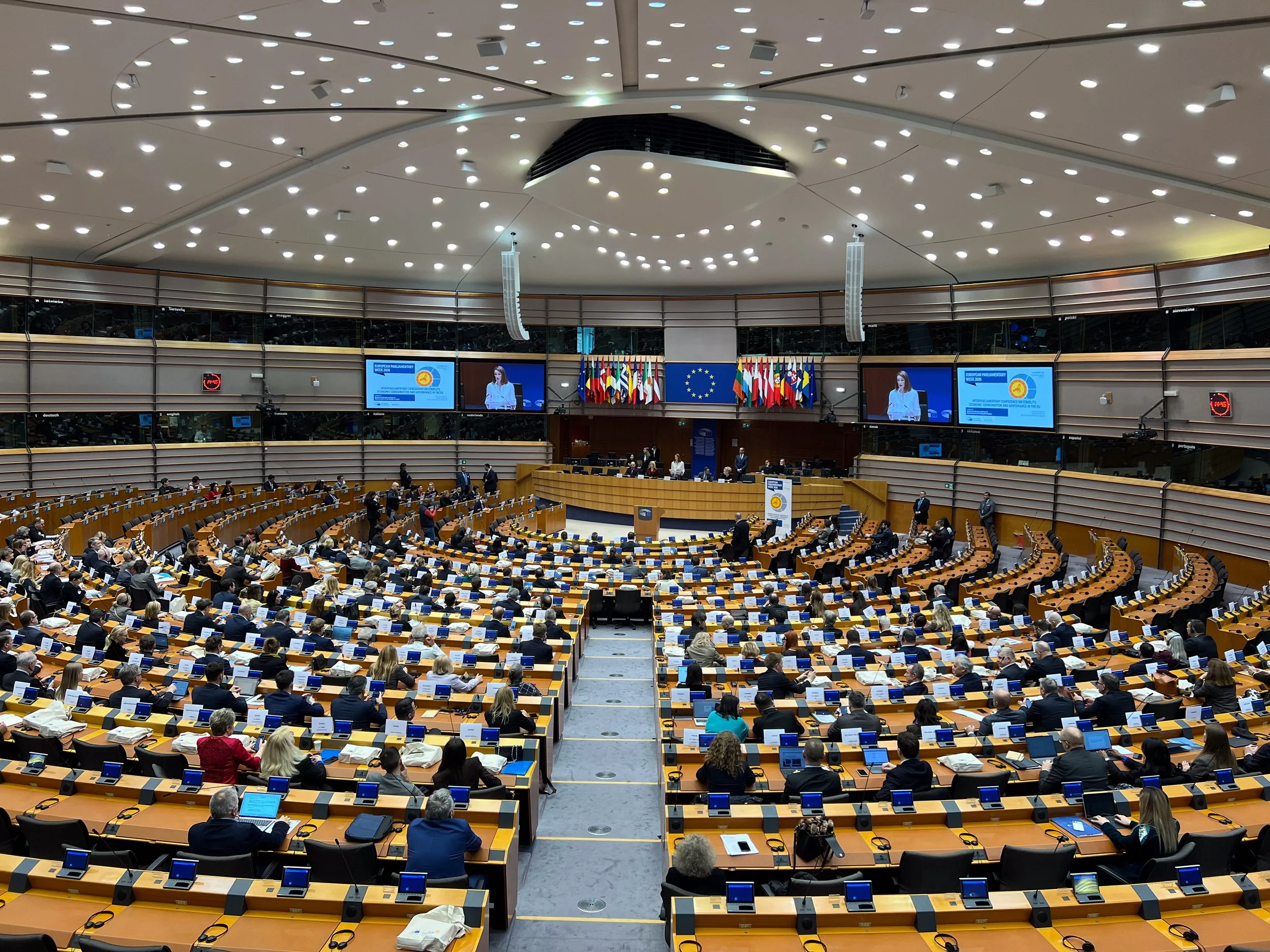 Inside the Hemicycle. We were lucky enough to arrive just as Roberta Metsola, the current President of the European Parliament, was speaking. She spoke in English, but the next speaker addressed the audience in Greek, which gave us the opportunity to