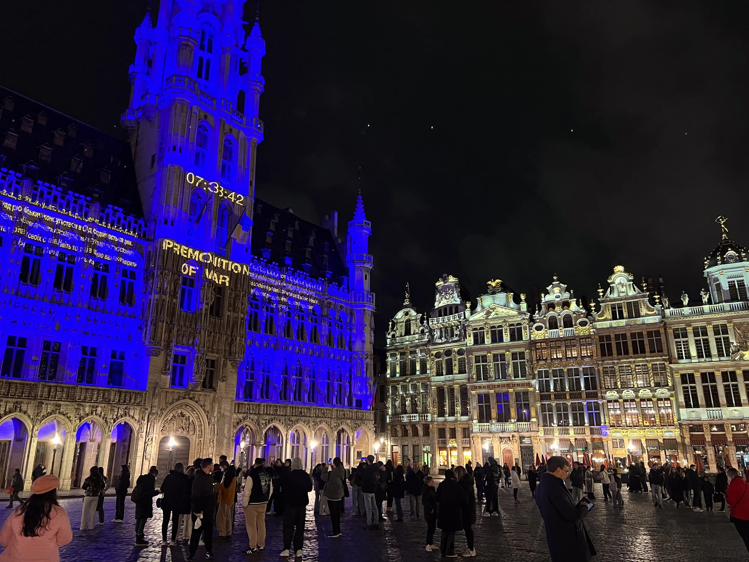 "Premonition of War." This was the night before the 4th anniversary of Russia invading Ukraine: a clock projected onto the Town Hall counted down until the moment it happened.