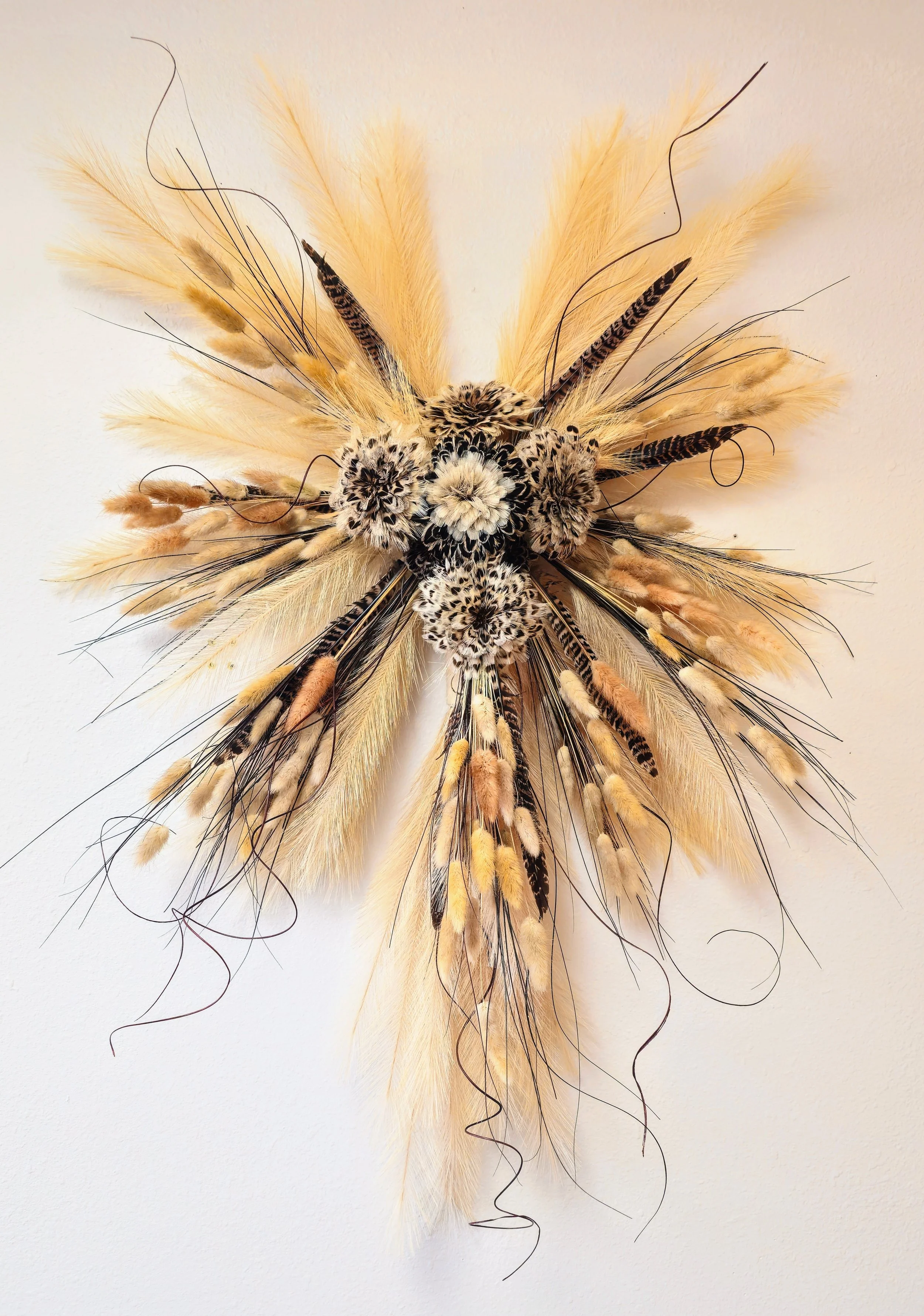 Flowers made of feathers in a vase