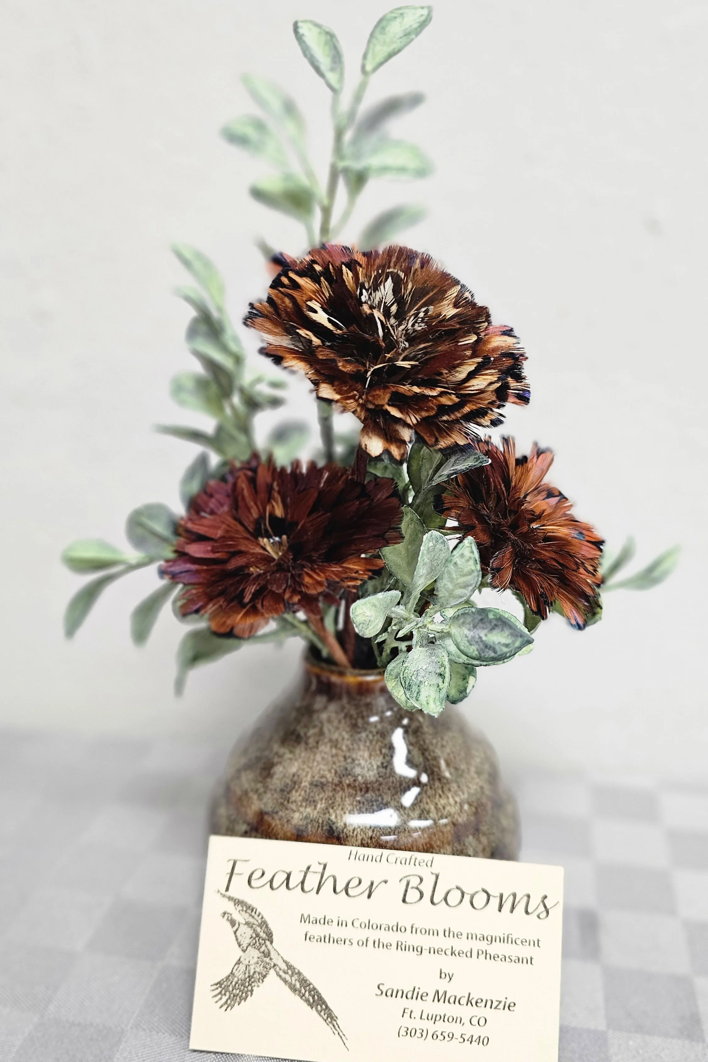 Flowers made of feathers in a vase