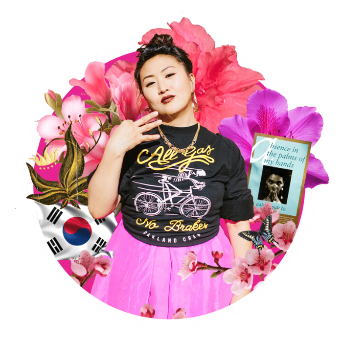 A woman with dark hair styled in an updo, wearing a black shirt with gold lettering and a pink skirt, surrounded by pink and purple flowers, a South Korean flag, a book titled 'Absence in the palms of my hands,' and a butterfly.