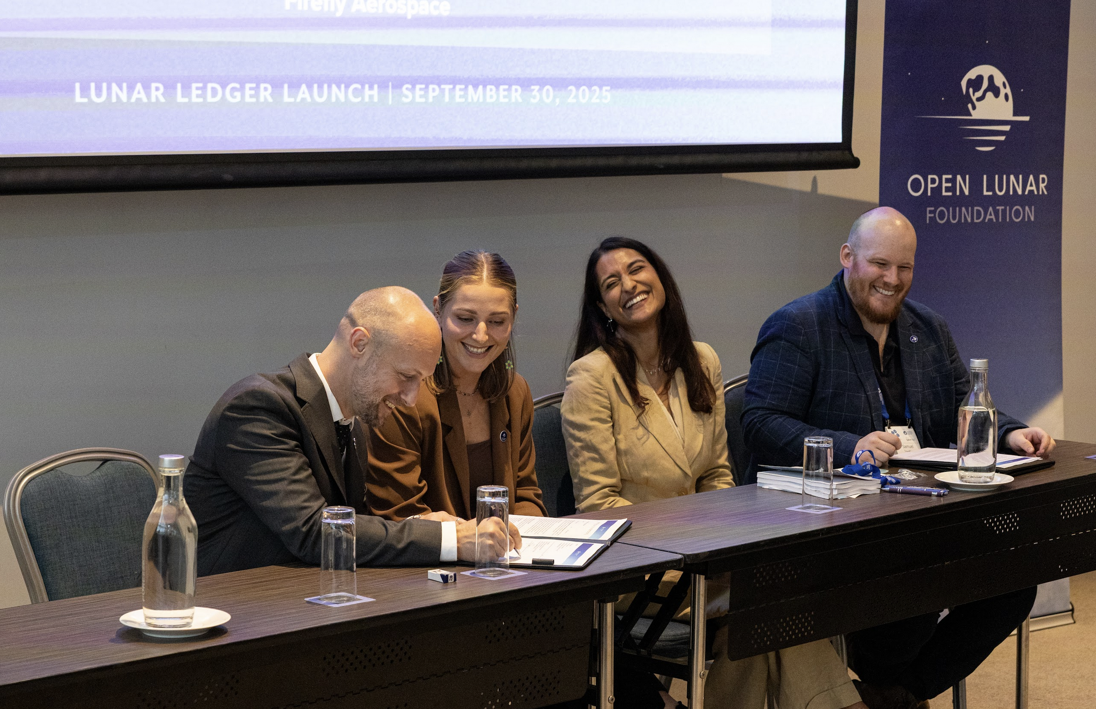 Firefly Aerospace signing Open Lunar's Lunar Ledger at the International Astronautical Congress 2025 in Sydney, Australia.