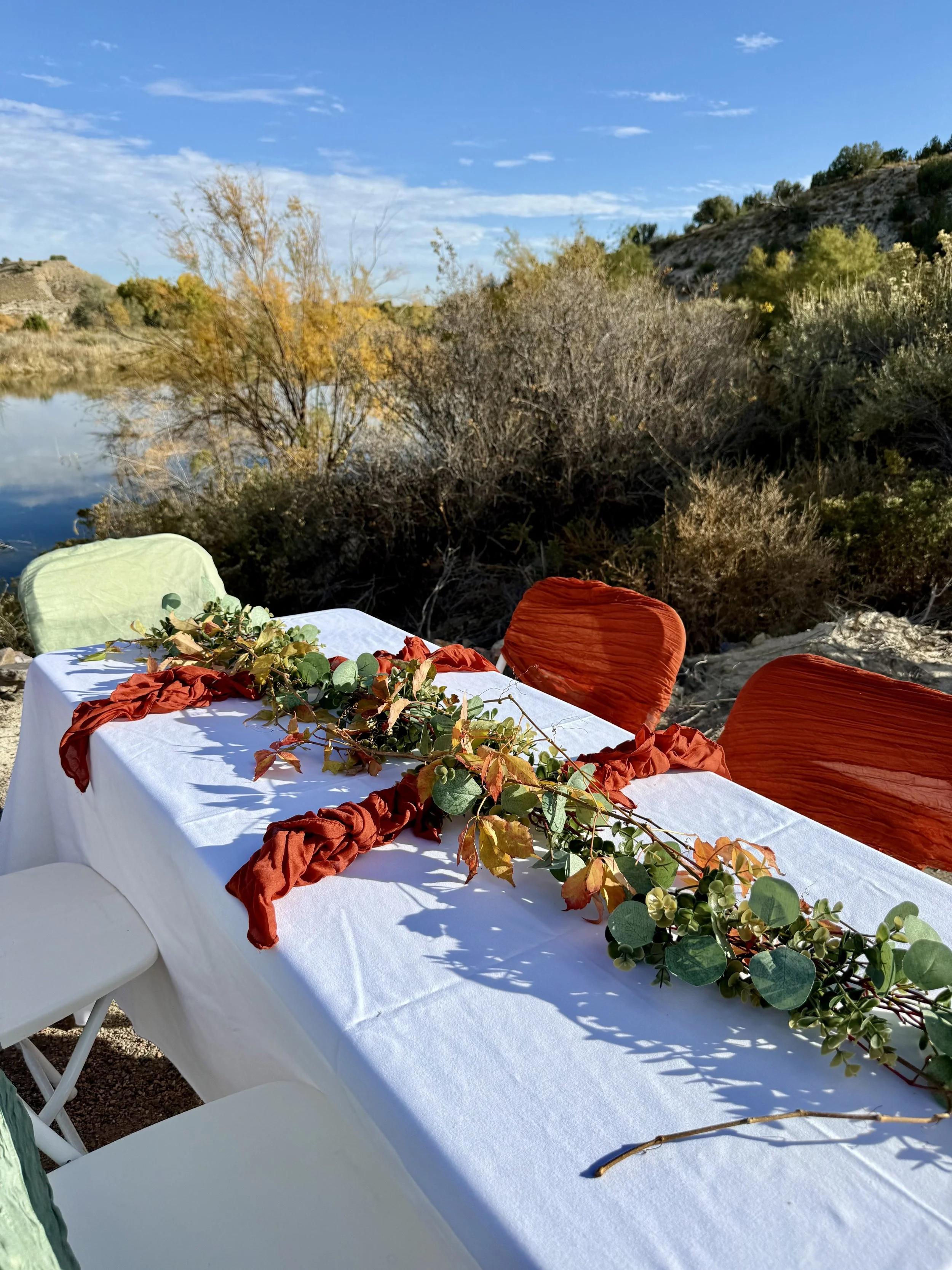 Outdoor pondside wedding reception at Lost Pond wedding venue near Canon City, Colorado.