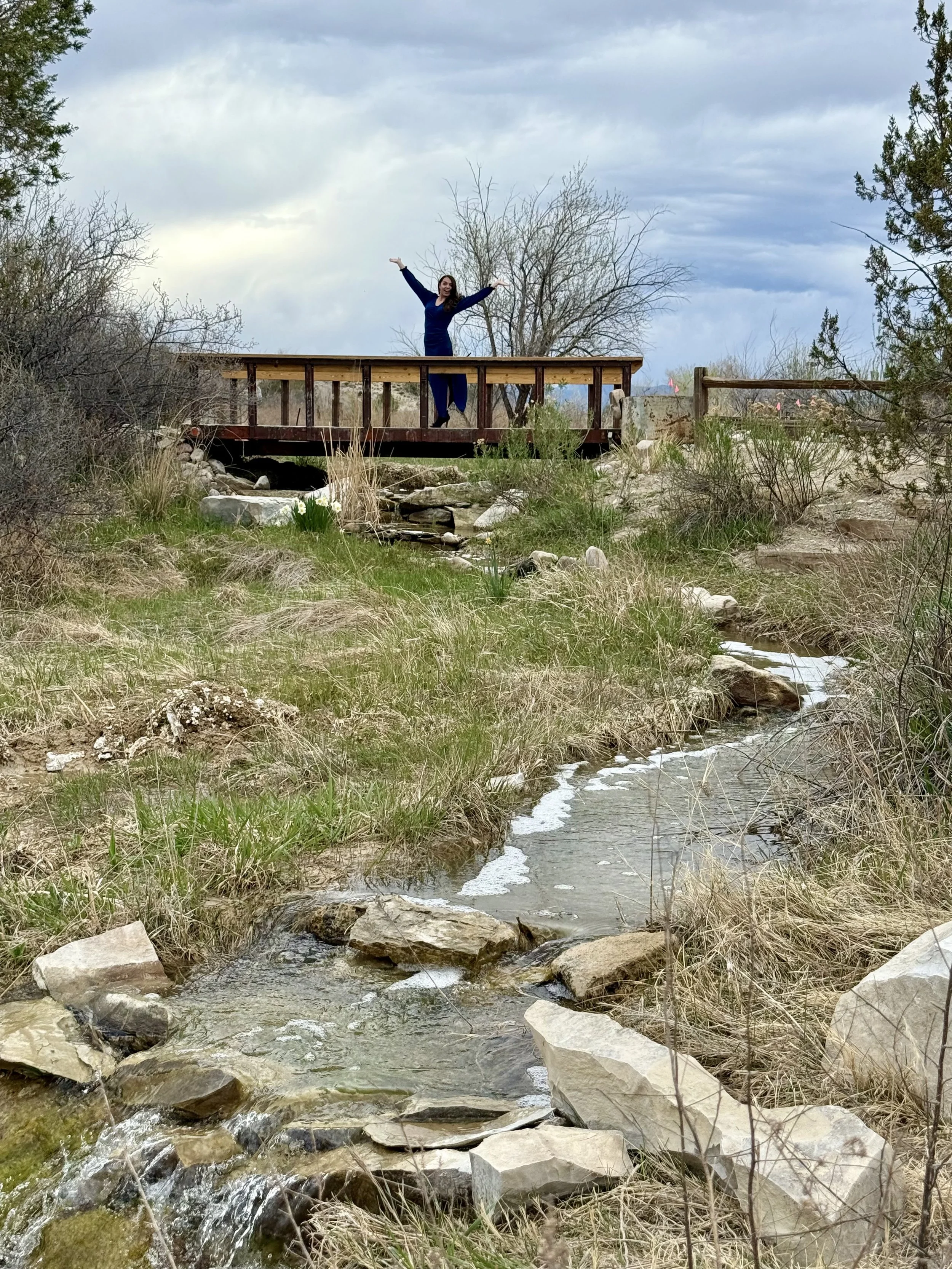 The stream and waterfalls falling over rocks at Lost Pond wedding venue near Canon City, Colorado