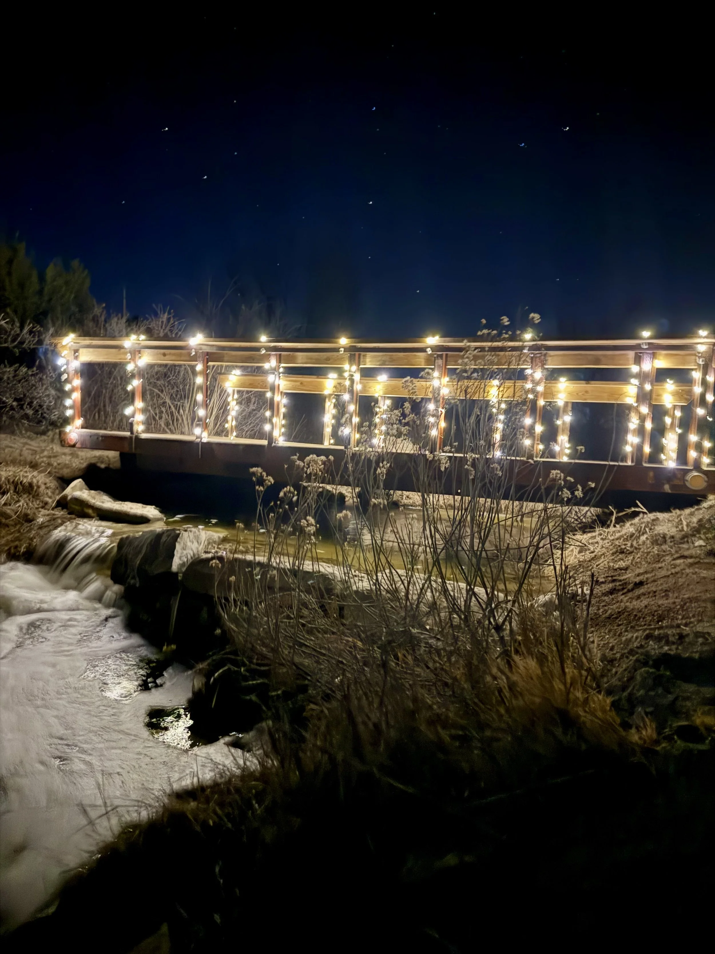 Bridge over waterfall at rustic wedding venue near Canon City Colorado in Penrose.