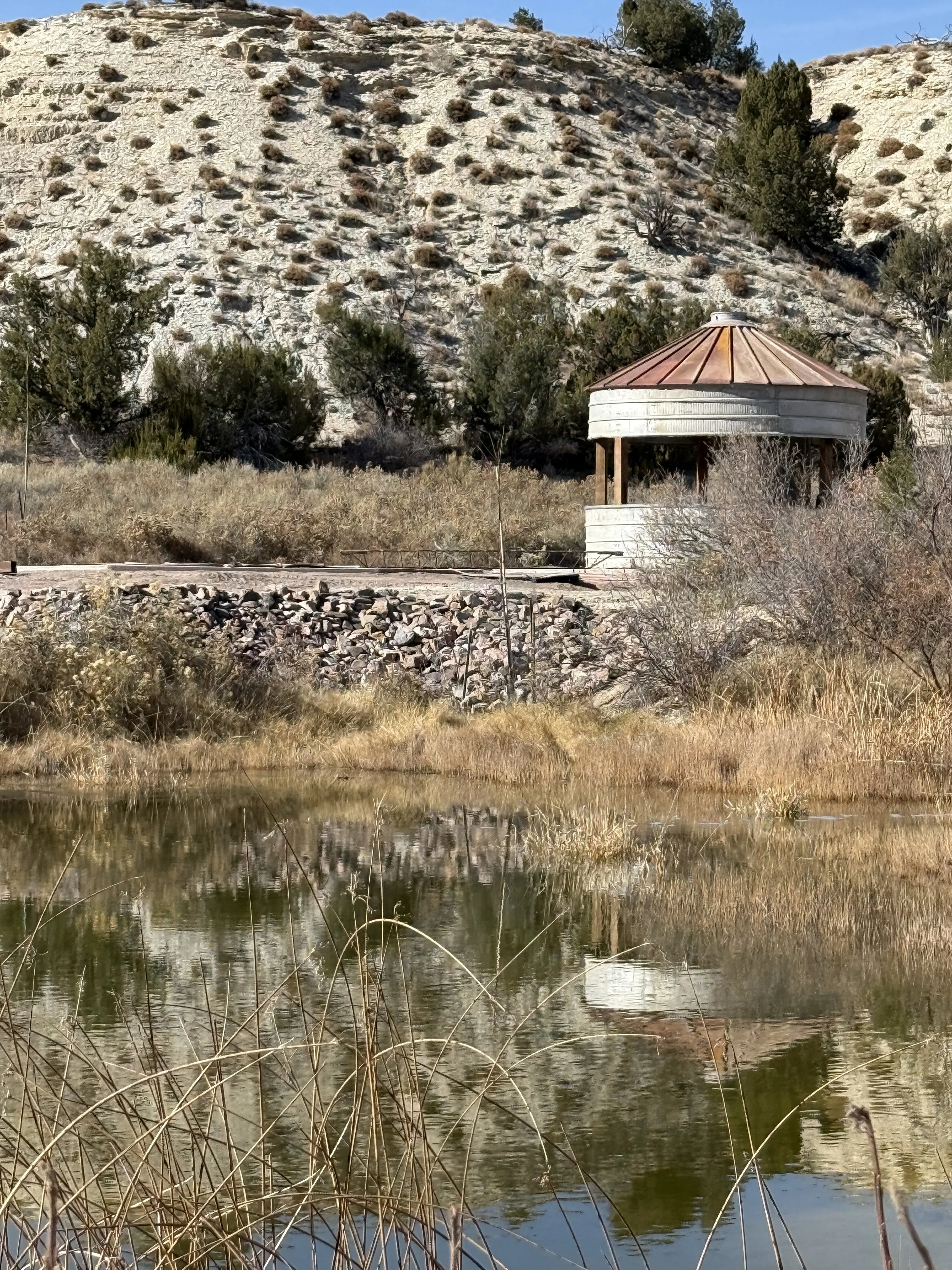 Rustic silo across the pond at Lost Pond luxury outdoor wedding venue near Canon City Colorado