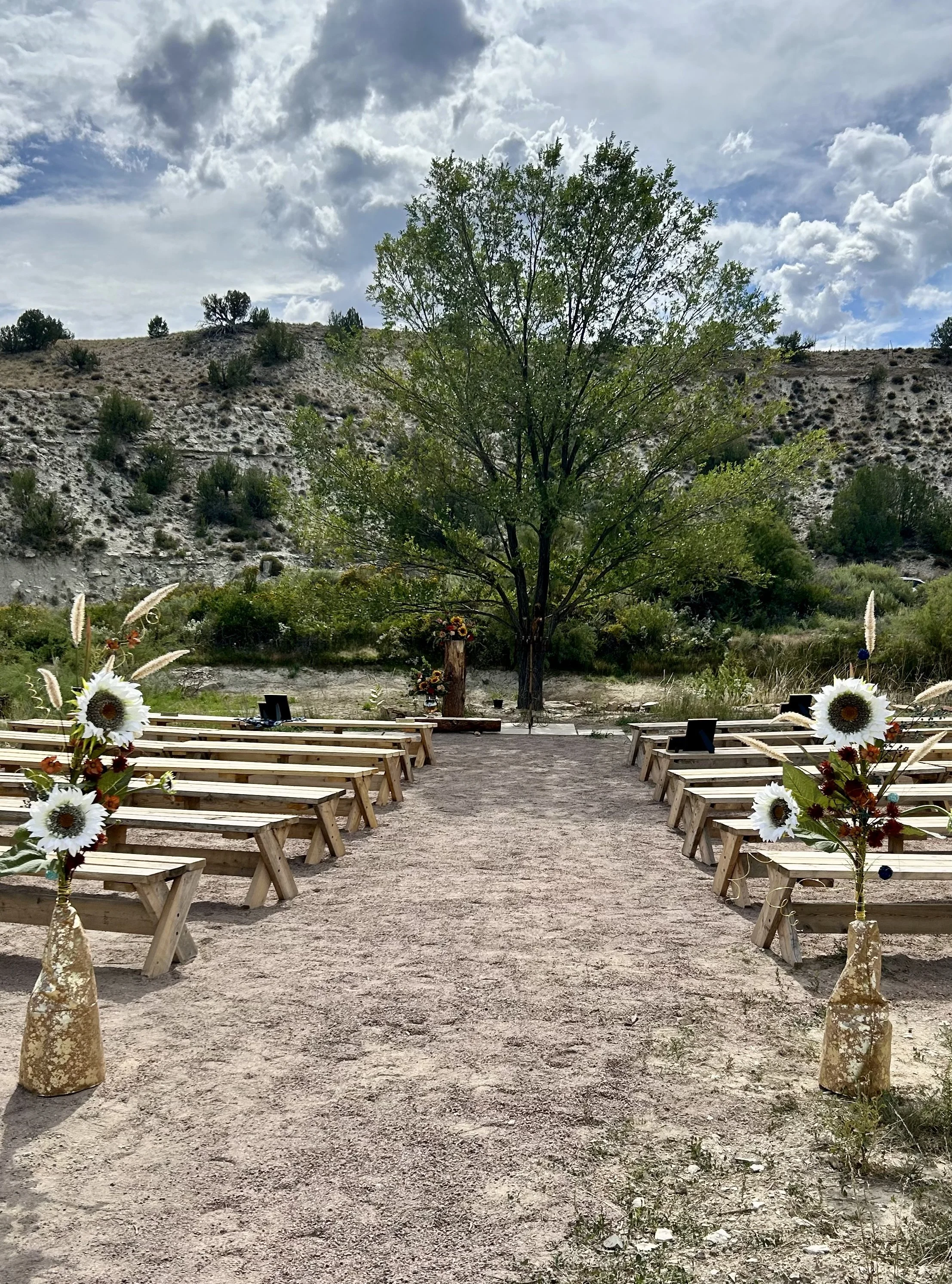 Outdoor pondside wedding ceremony site at Lost Pond wedding venue near Pueblo, Colorado.