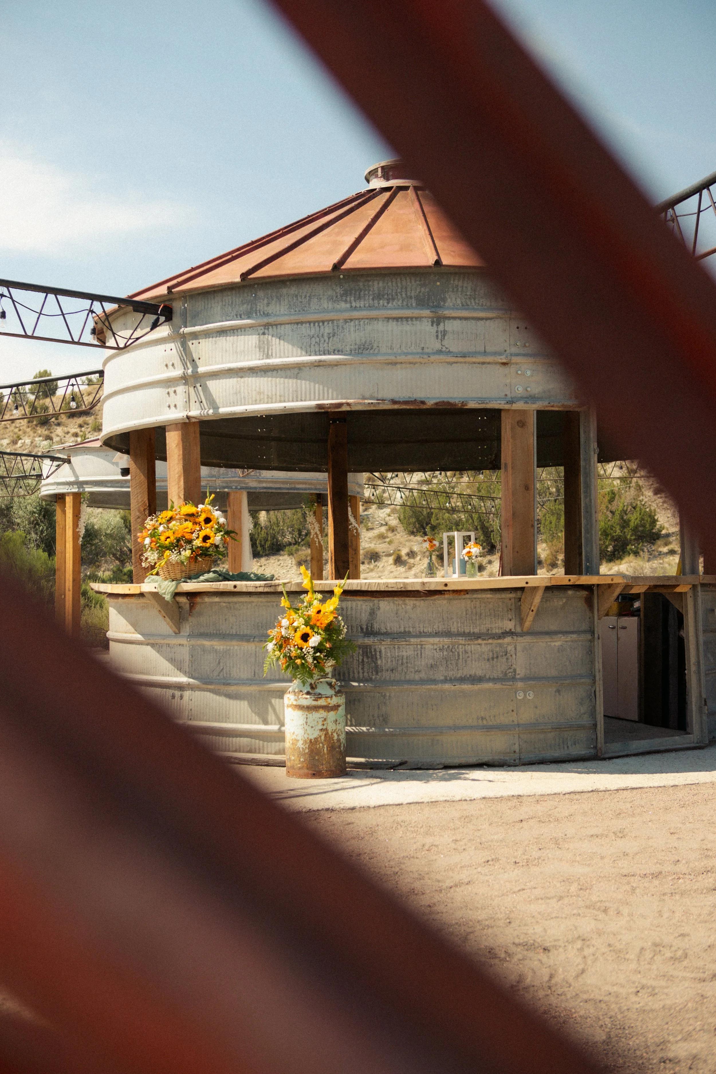 Rustic, vintage silo decorated with sunflowers for an outdoor wedding at Lost Pond wedding venue near Canon City, Pueblo, and Colorado Springs, Colorado,