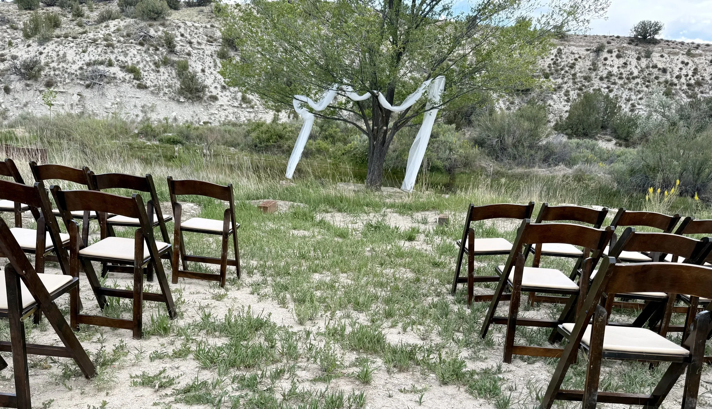 The pondside wedding ceremony at Lost Pond wedding venue, an outdoor wedding venue near Colorado Springs, Colorado.