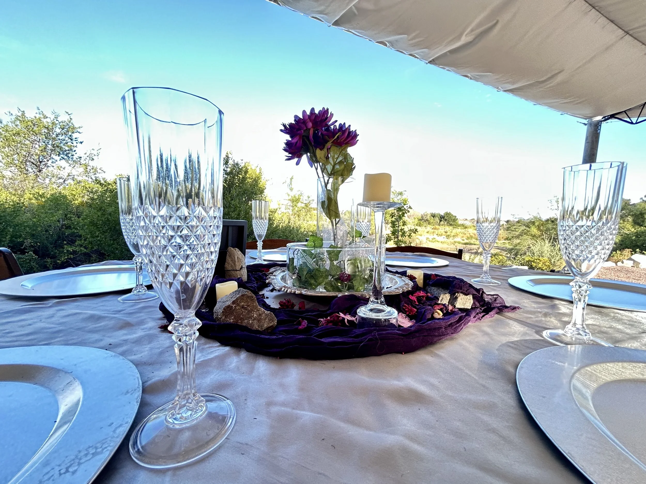 Pondside wedding reception under the tented canopy at pondside outdoor wedding venue Lost Pond. Lost Pond is located between Canon City and Colorado Springs, Colorado.