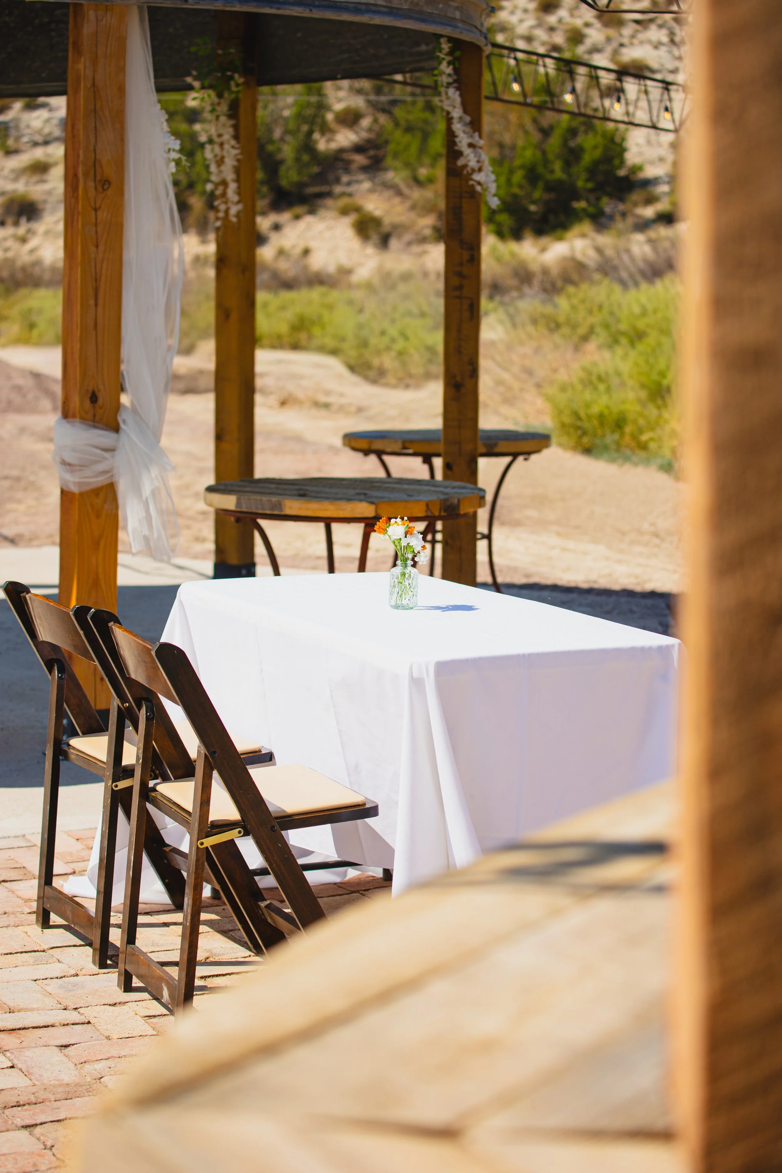 Lost Pond outdoor wedding venue set up for  outdoor wedding under the string lights in Penrose, Colorado.