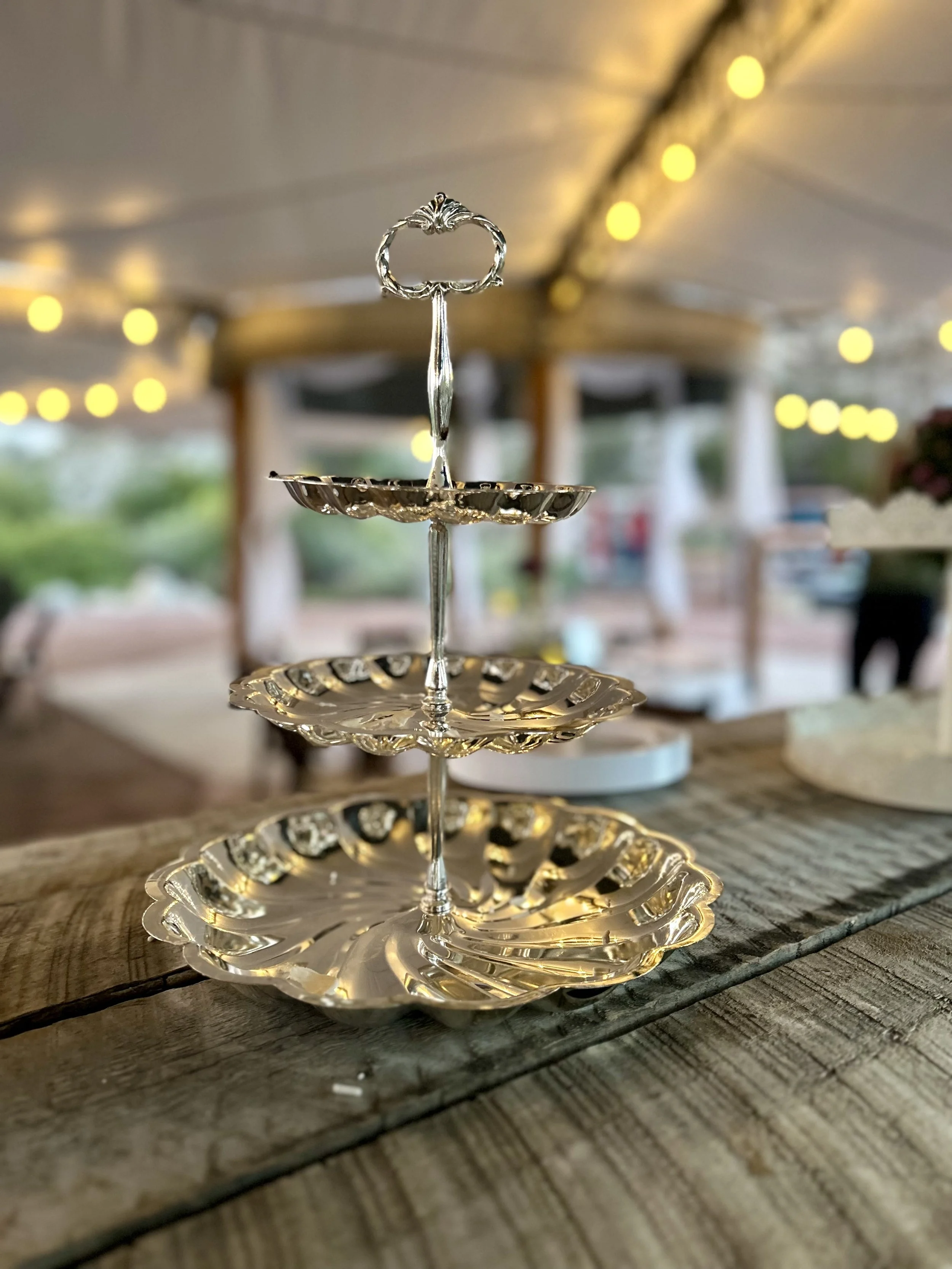 Cake stand on rustic silo bar at Lost Pond wedding venue between Canon City and Pueblo, Colorado.