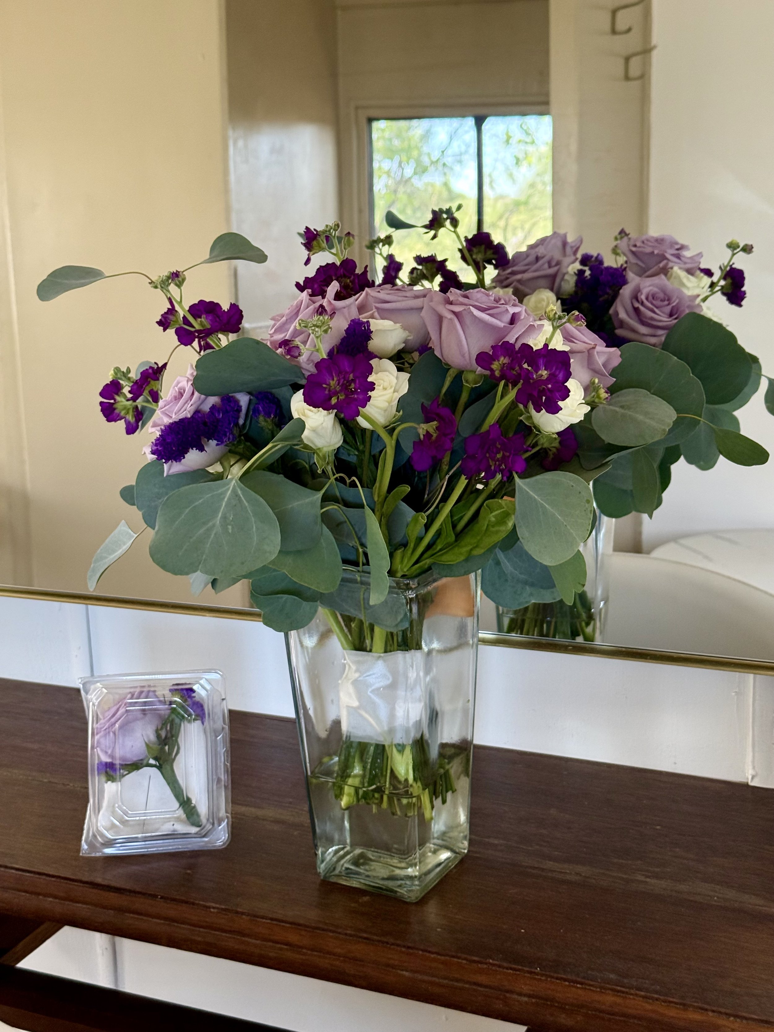 Purple and white bridal bouquet set in the Salon bridal suite at Lost Pond wedding venue located between Colorado Springs and Canon City, Colorado.