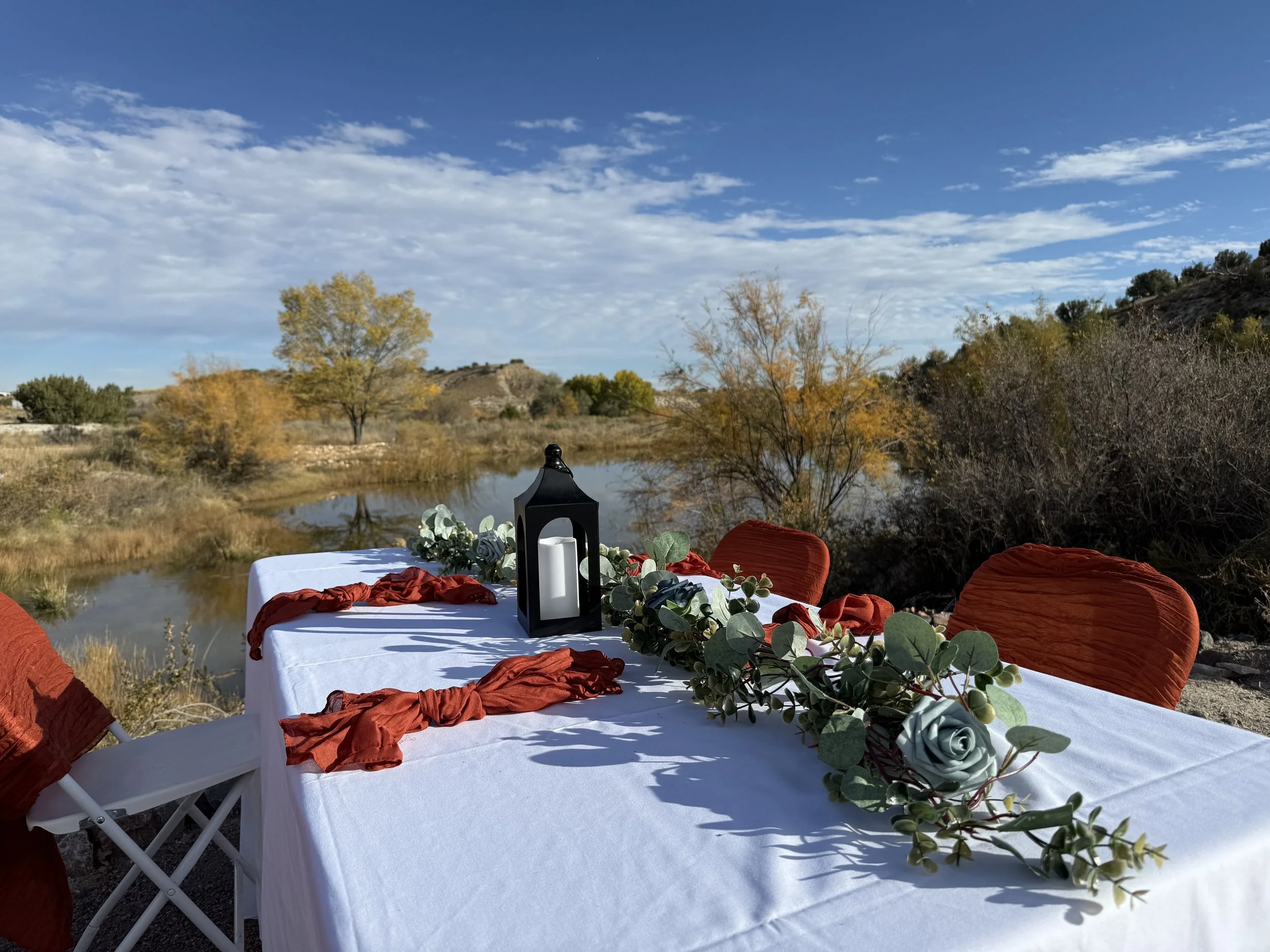 Waterside wedding venue reception at pond by mountains rustic outdoor Canon City Colorado