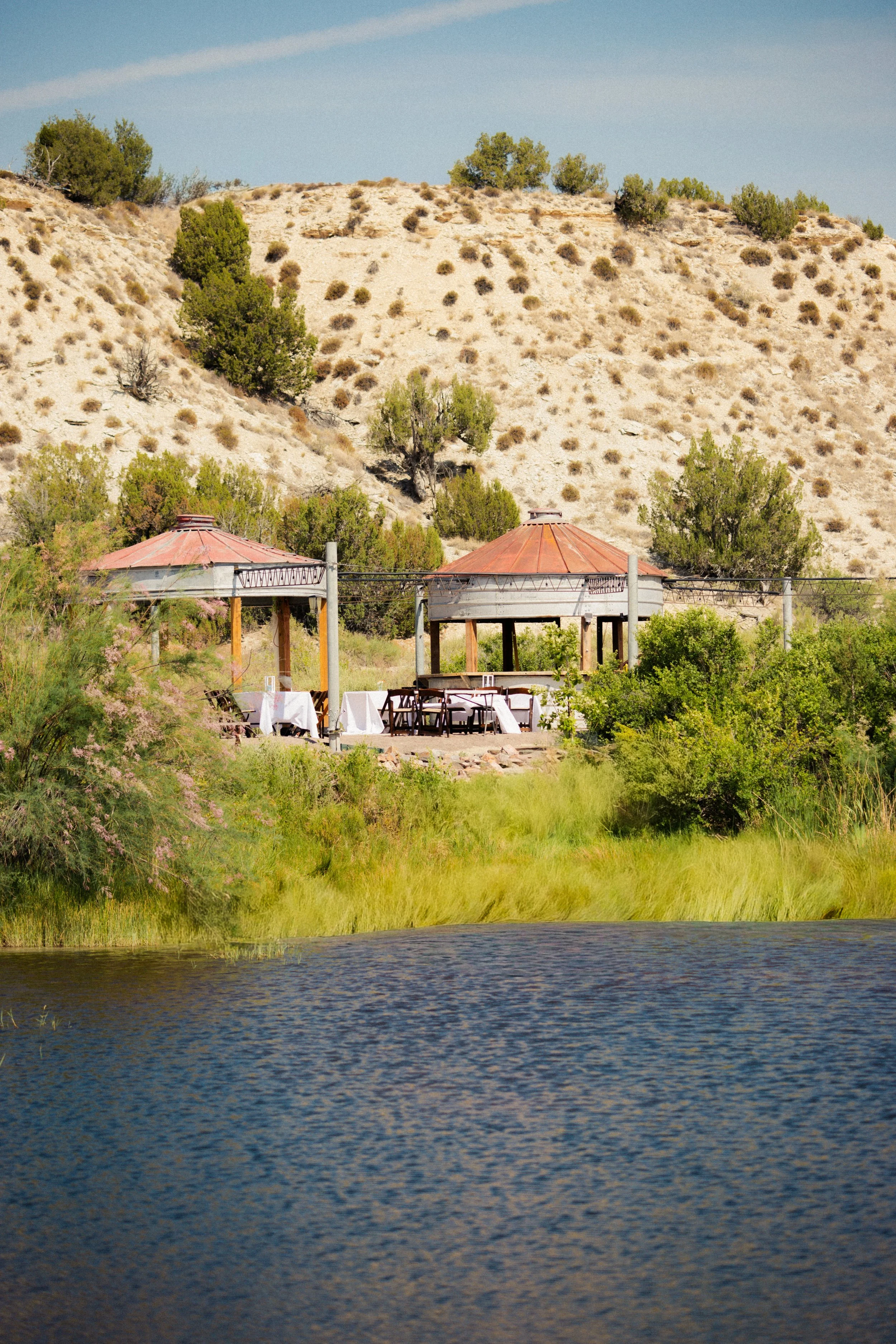 Silo dance floor and bar as seen across the pond at Lost Pond wedding venue near Canon City, Colorado Springs, and Pueblo, Colorado.