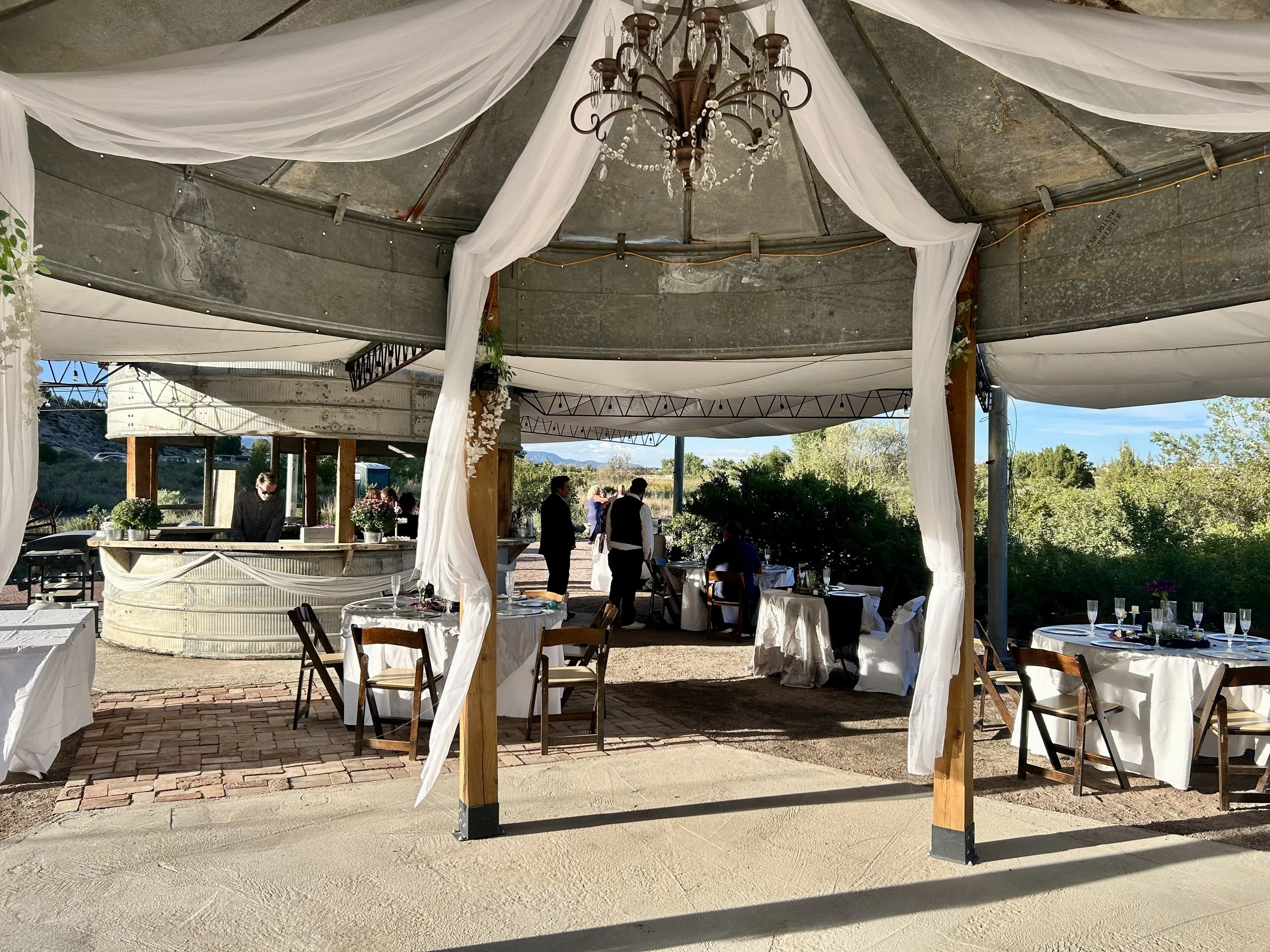 The dance floor silo Gazebo has a vintage chandelier and plenty of room for dancing and socializing.