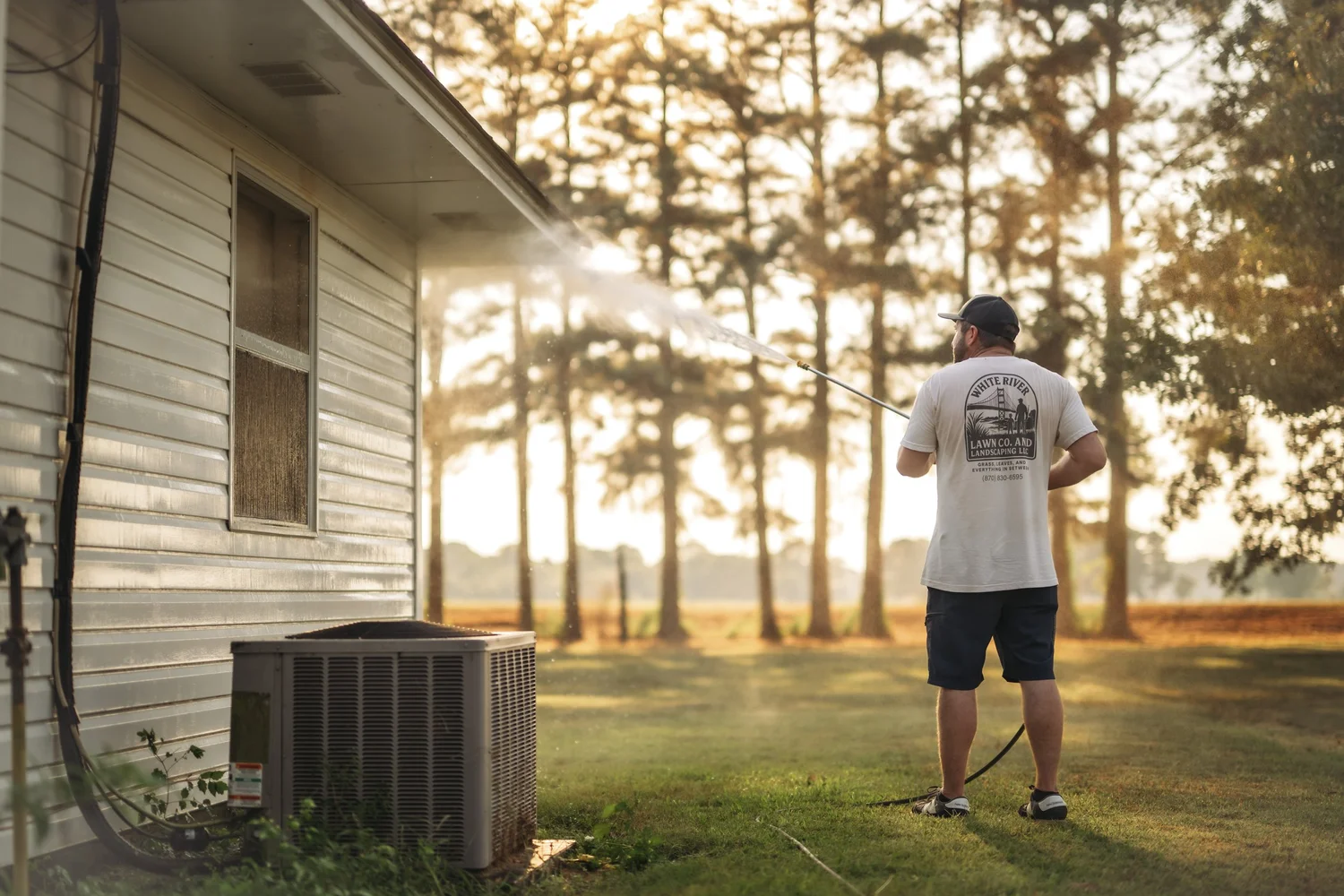White River Lawn pressure washing a home exterior