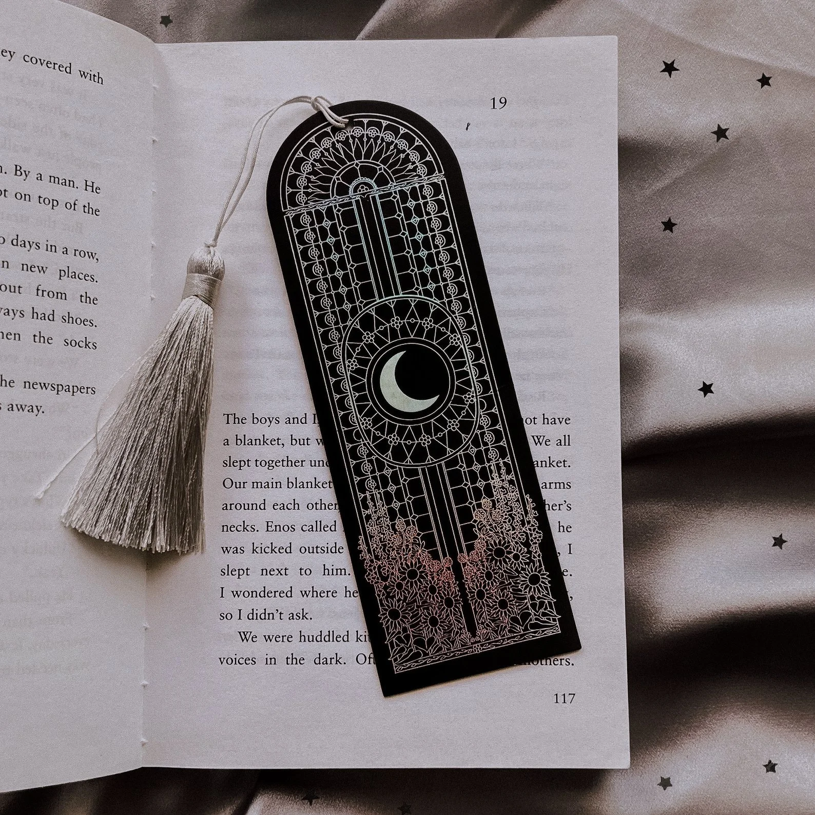Black bookmark featuring iridescent foil detailing with celestial and floral designs. Ideal for dark academia enthusiasts, gothic readers, and anyone looking to add a mystical touch to their books.