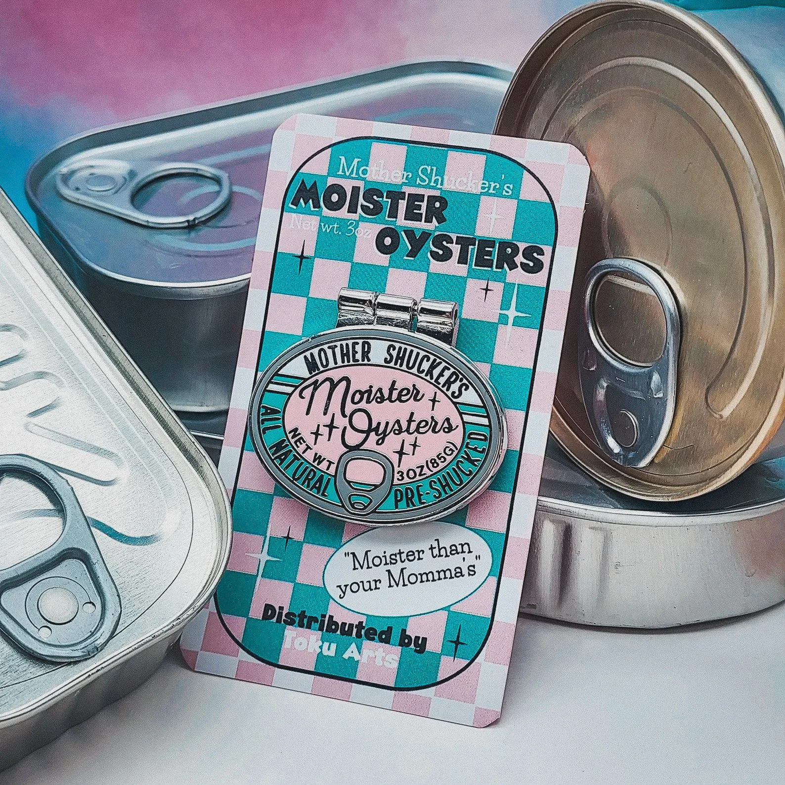 Quirky enamel pin shaped like a tin of oysters, perfect for seafood lovers, cottagecore fish girls, or ironic culinary flair.