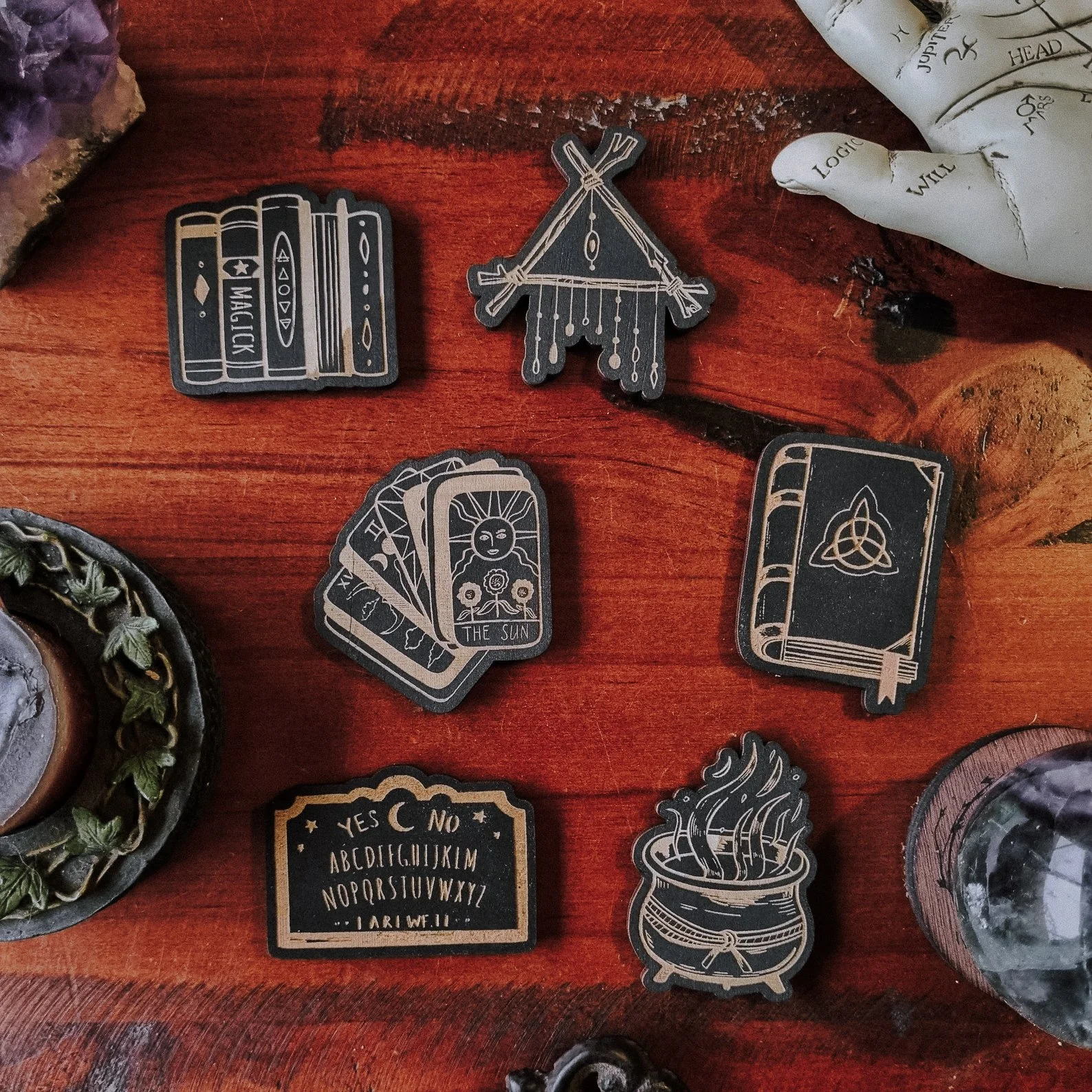 Halloween-themed magnet set featuring witchy icons and mystical designs.
