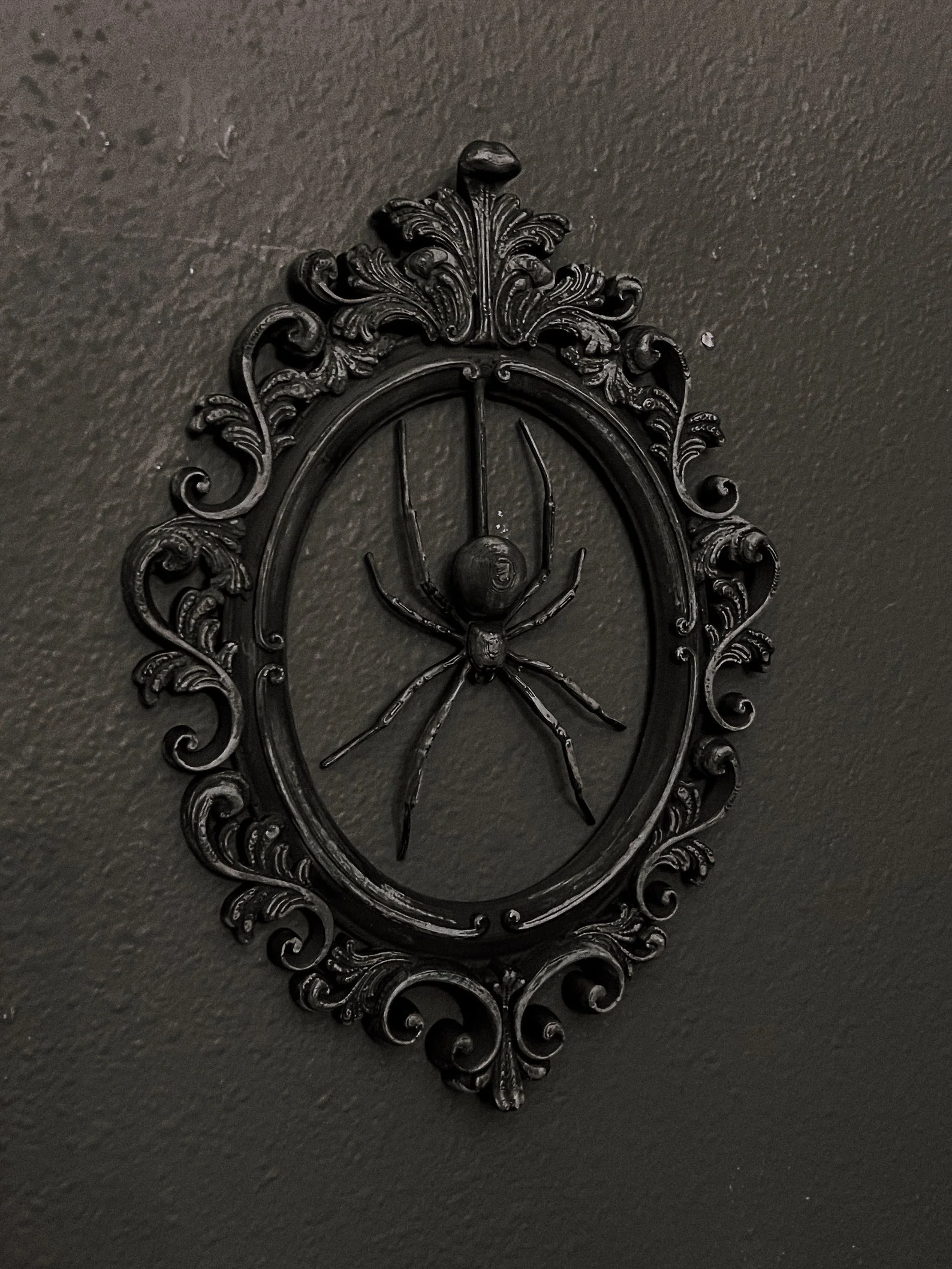 Realistic spider figure displayed in a gothic-style ornate frame, designed for spooky gallery walls and vintage horror-inspired decor lovers. Perfect for Halloween or year-round creepy vibes.