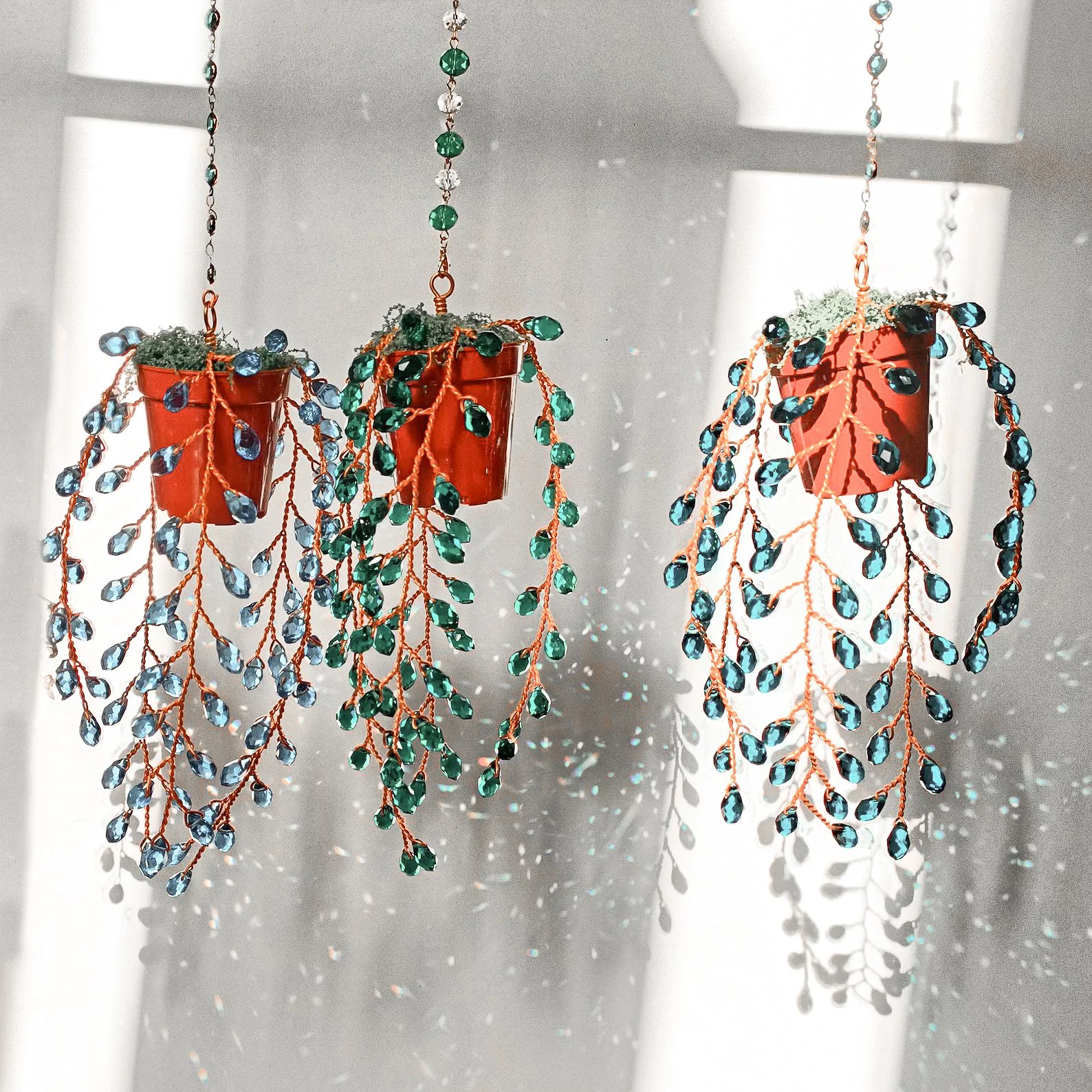 Handmade beaded suncatcher with a tiny succulent charm and prism crystal, perfect for windows, gardens, or boho decor lovers.