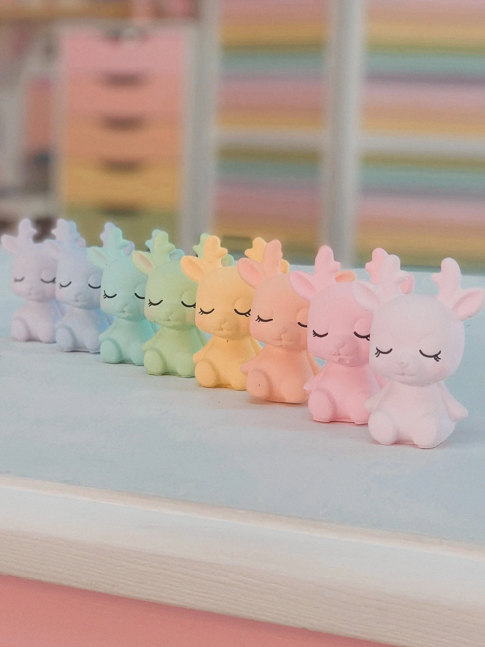 This pastel rainbow reindeer shelfie from TildaLovesTeddy is a charming addition to any holiday decor. Standing approximately 7 cm tall, each reindeer is handcrafted from hard plaster and features rosy cheeks, closed eyes, and a serene expression. Av