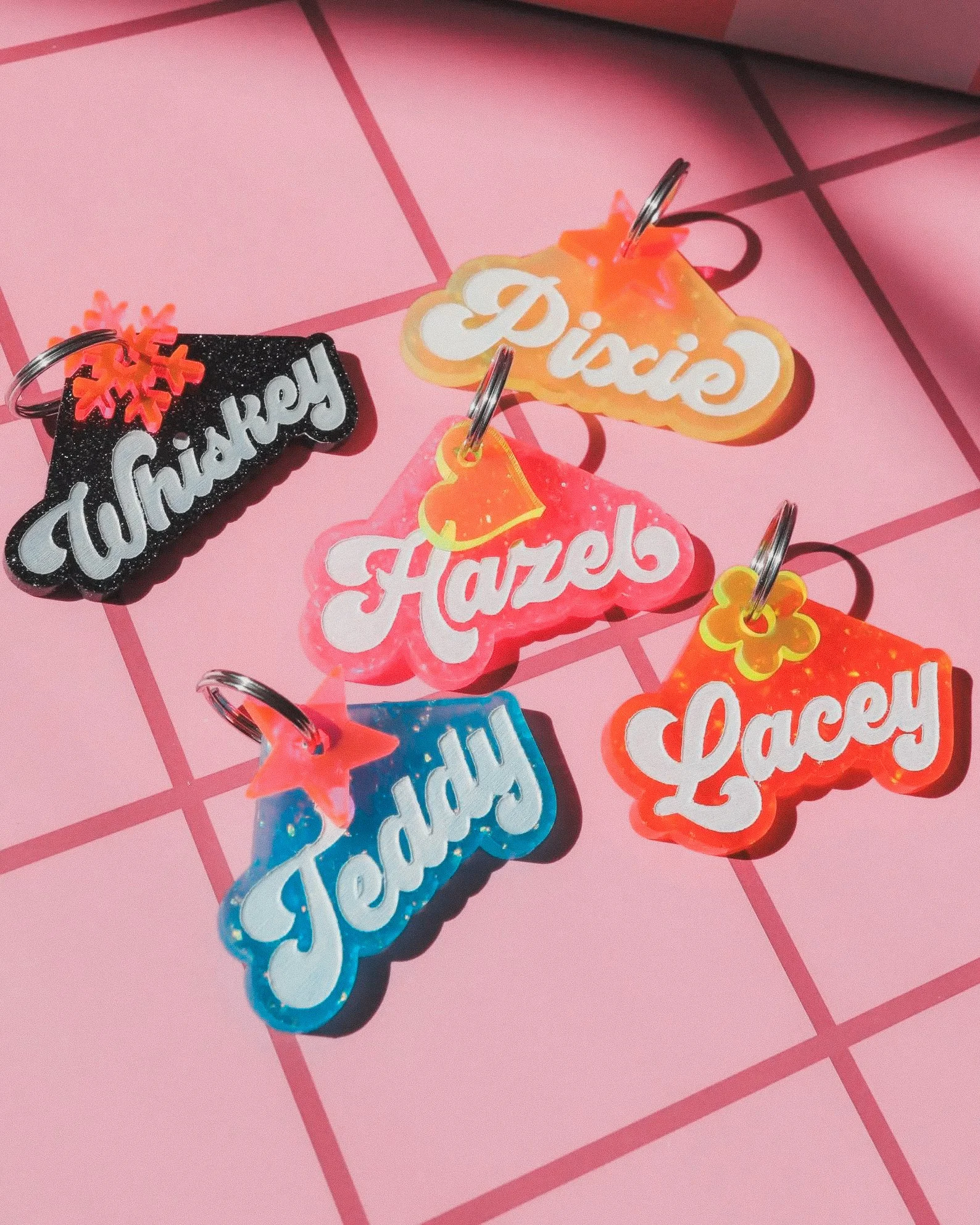 CUstom resin neon glitter dog tag IDs.