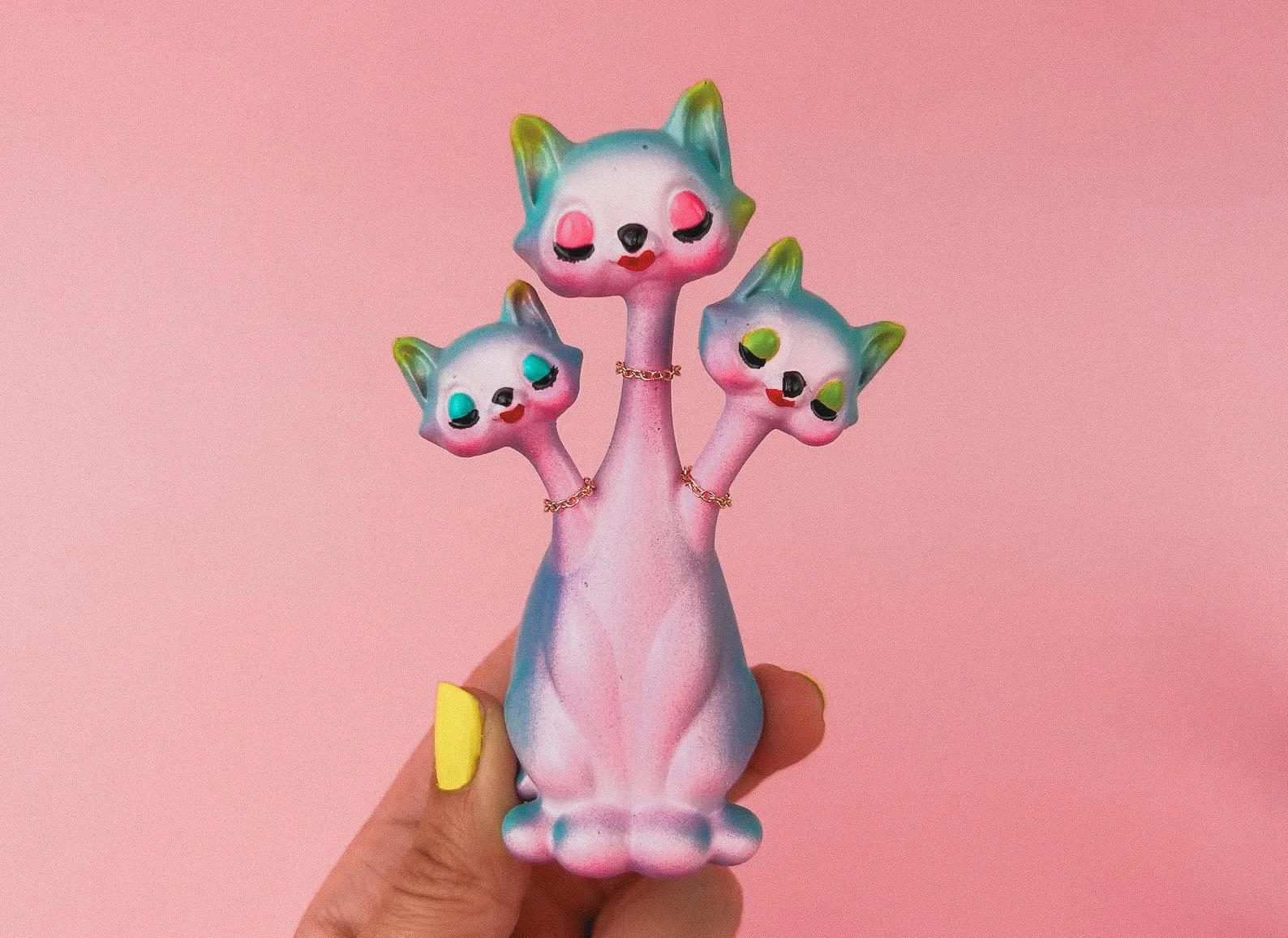 Anthropomorphic three-headed cat figurine with retro kitsch style, perfect for collectors of weird, whimsical, and maximalist decor.