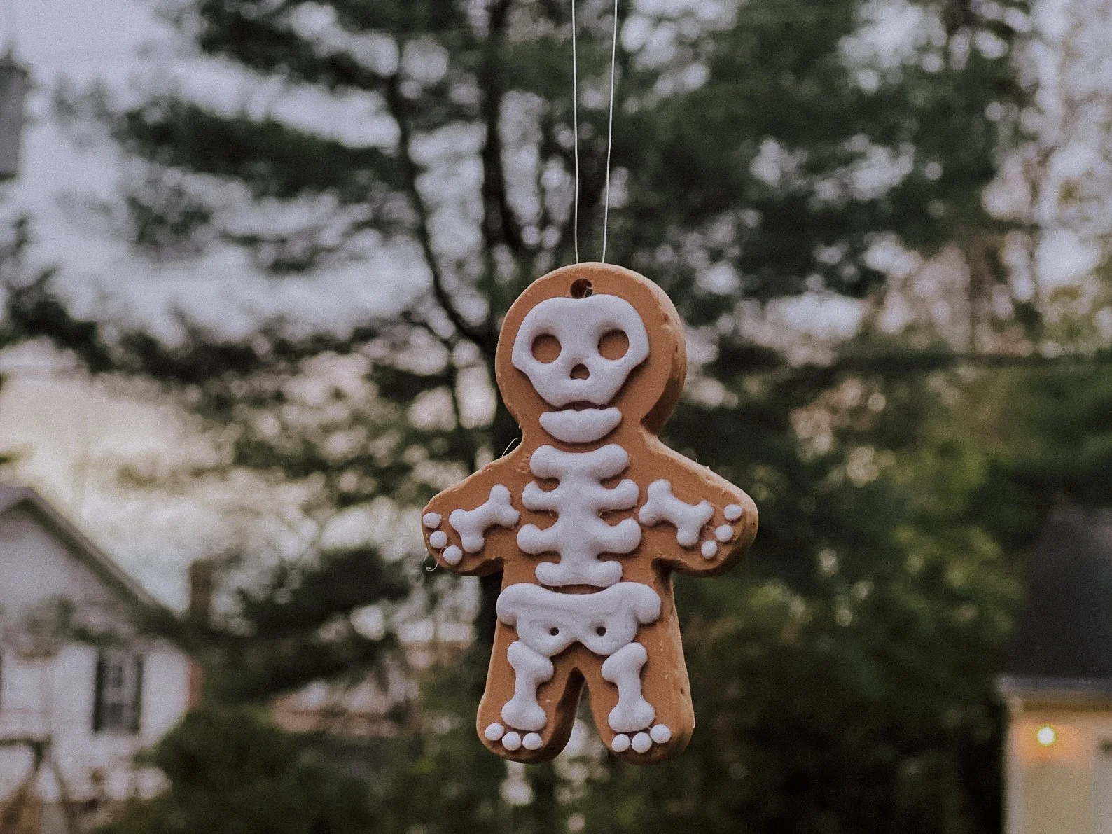 Skeleton-shaped gingerbread ornament that fuses creepy and cozy for the perfect goth holiday tree decoration.
