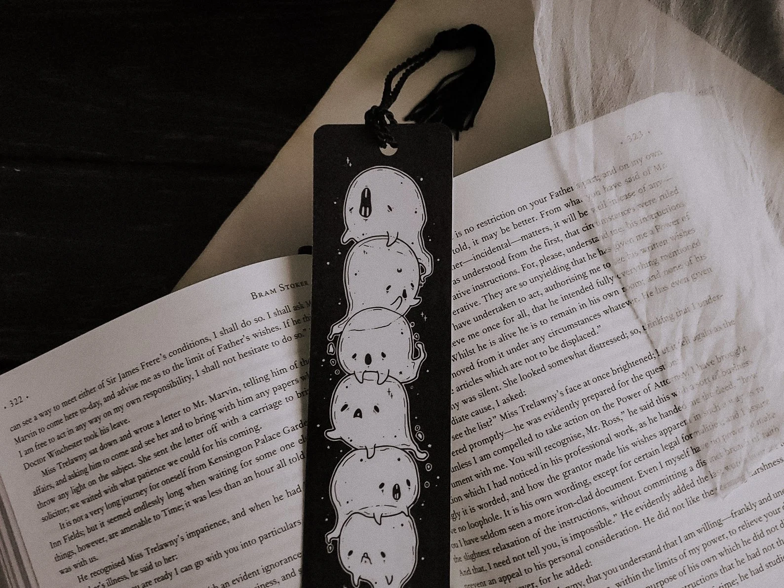 Ghost Pile bookmark showcasing a stack of cute ghosts, a spooky and fun accessory for readers.