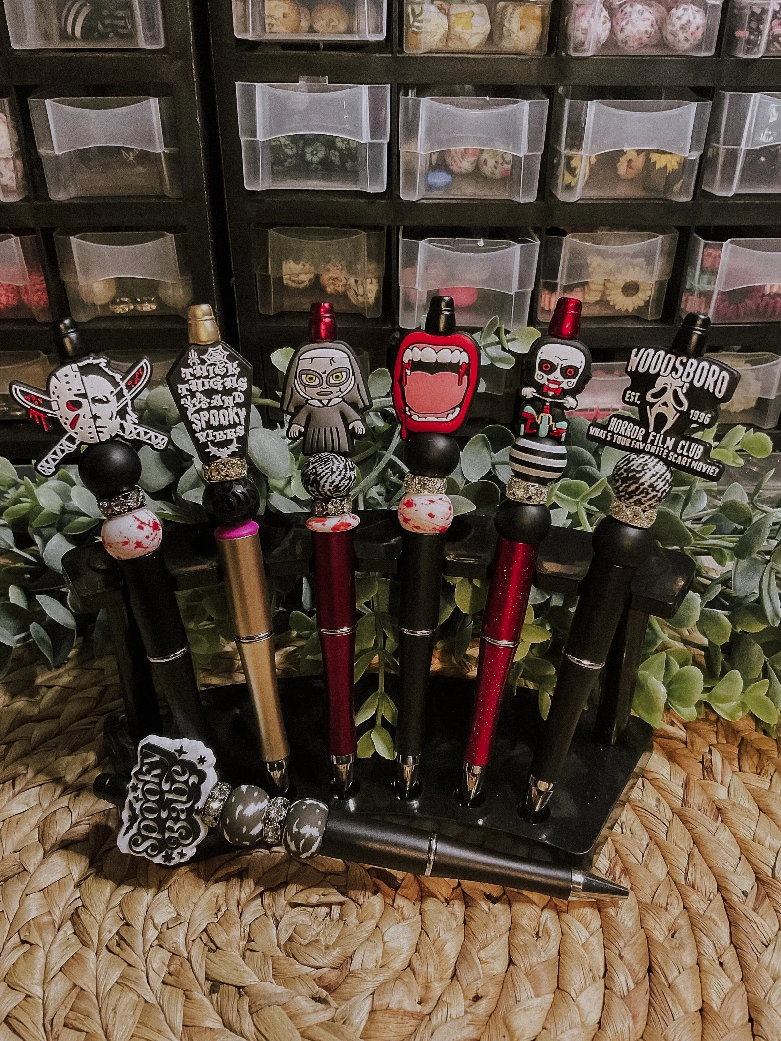 Handcrafted ballpoint pens featuring food-grade BPA-free silicone beads inspired by iconic horror movie characters. Each pen is refillable, comes with black ink, and includes one refill. Available in various styles such as Jason/Michael, Spooky Coffi