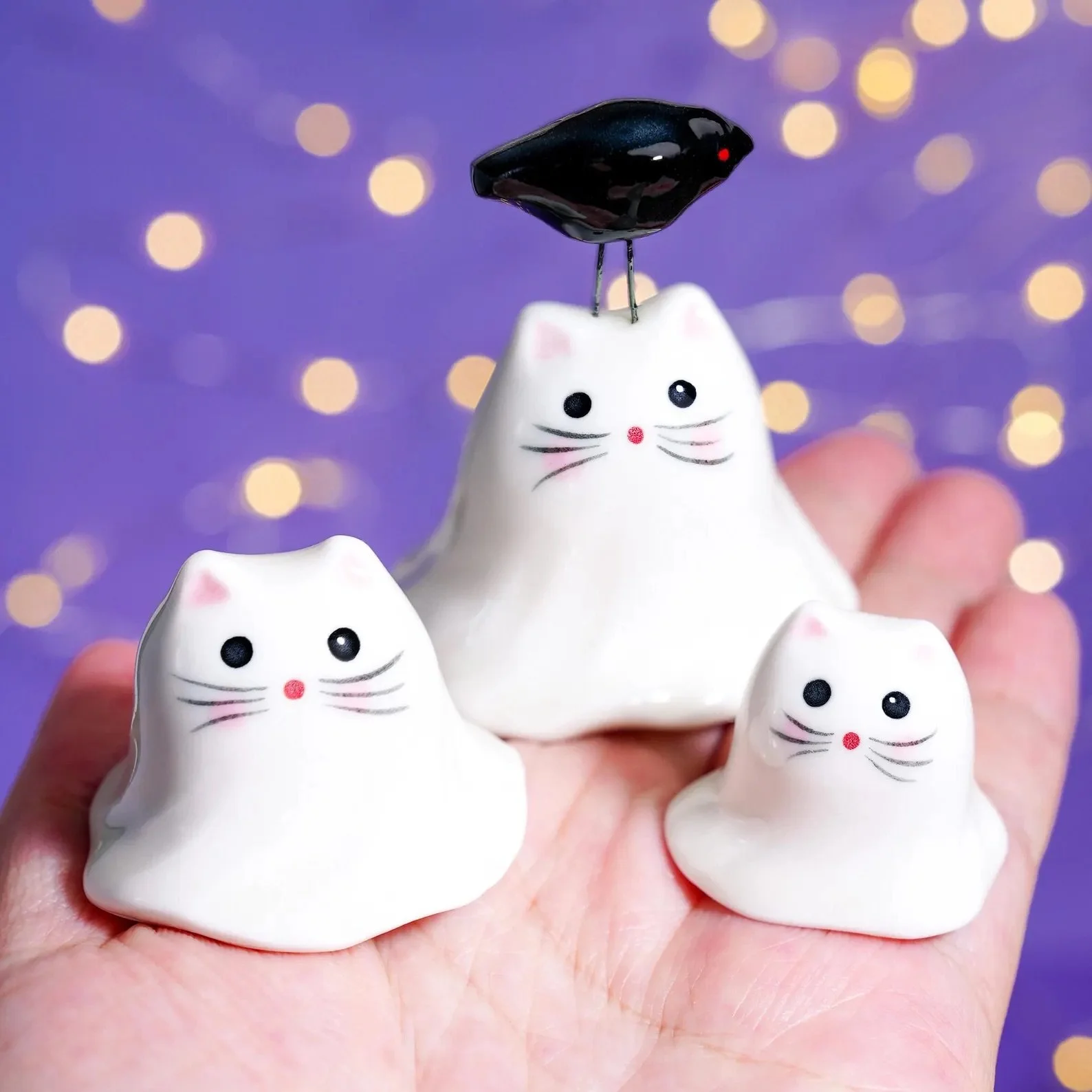 This handmade ceramic Halloween cat ghost figurine is the perfect blend of spooky and adorable. Crafted with care, it features a glossy ceramic glaze that adds a touch of charm to any space. Whether you’re a cat lover, a Halloween enthusiast, or some