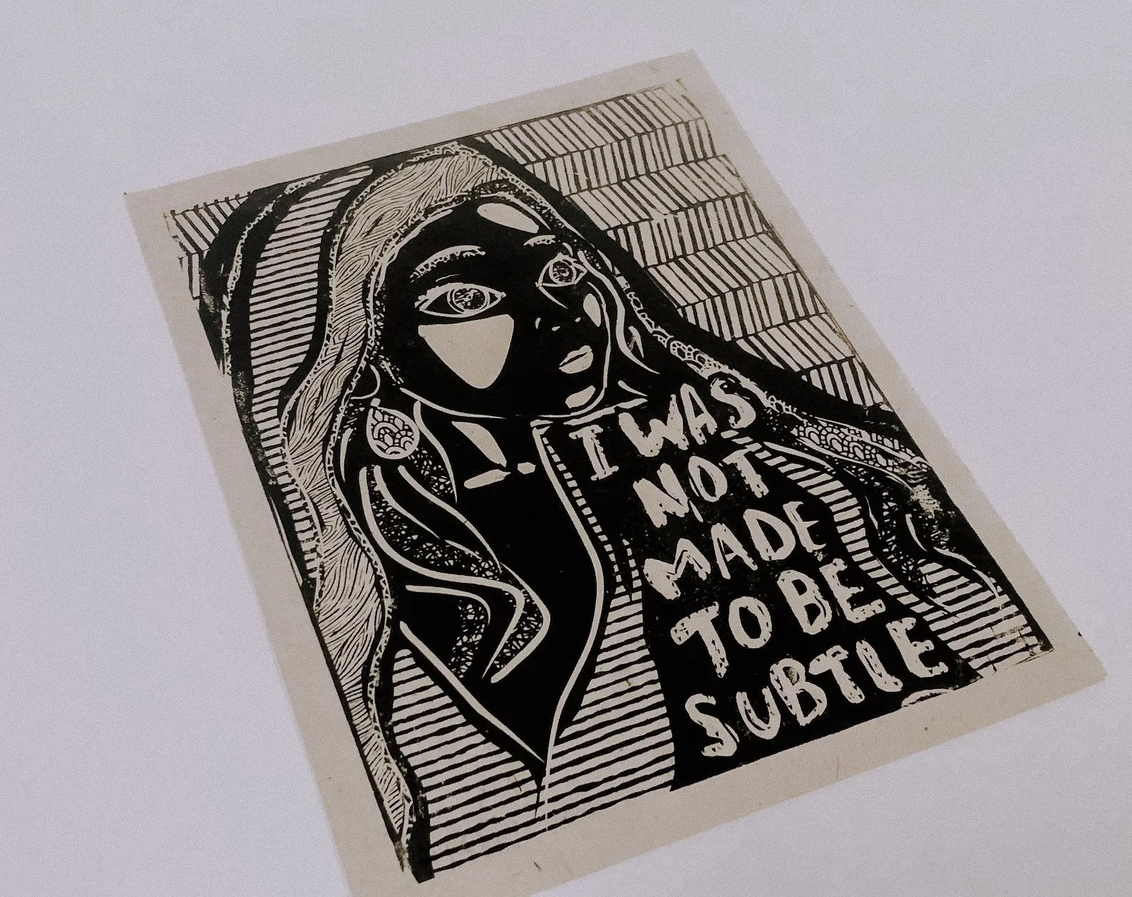 I Was Not Made to Be Subtle Art Print
Bold black and white linocut-style print featuring the empowering quote “I was not made to be subtle” with a hand-drawn, vintage flair.