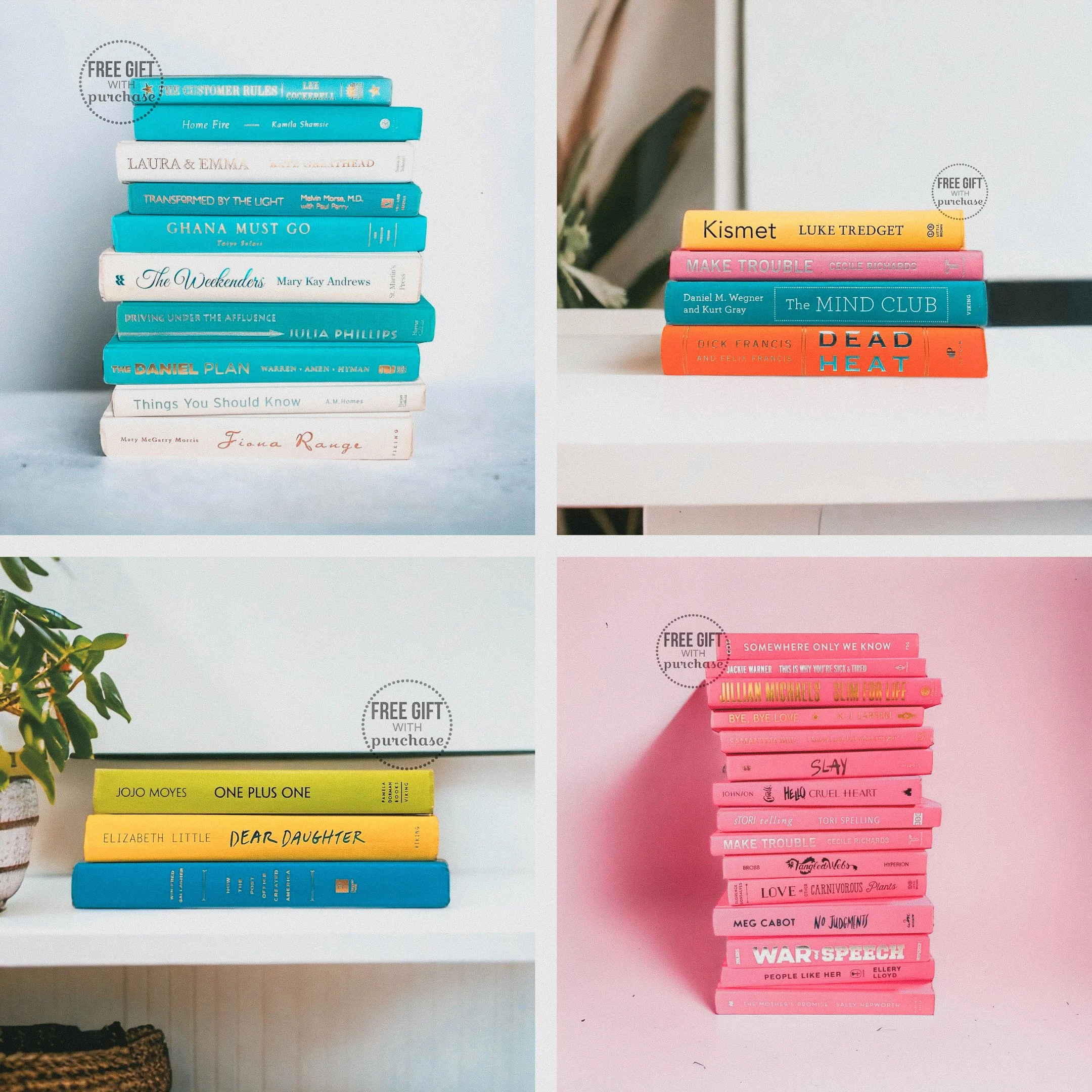 Four stacks of books arranged on white surfaces, with labels indicating free gifts with purchase in some stacks. The books vary in color and size, with titles visible on the spines.