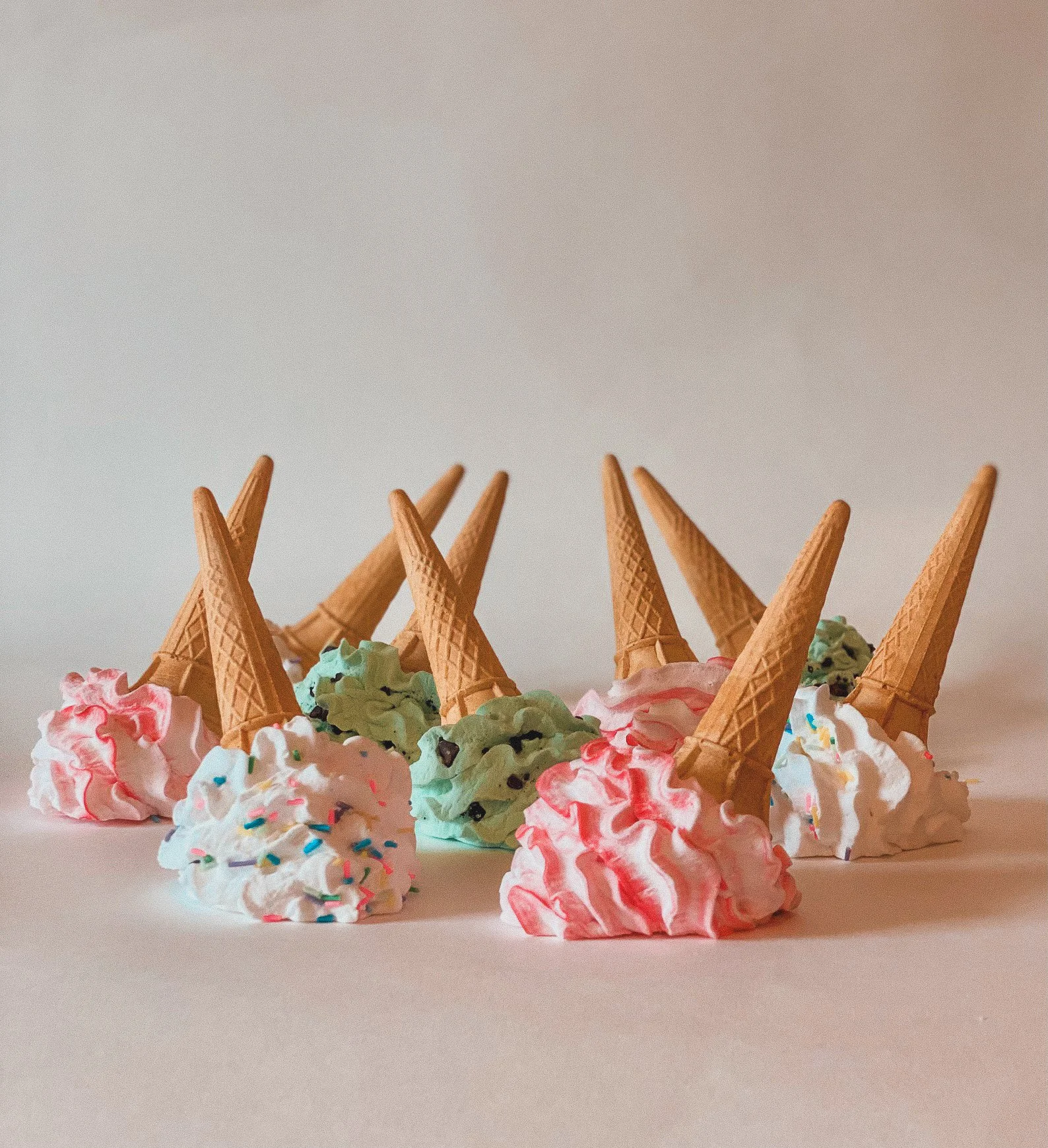 Hyperrealistic fake ice cream cone tipped over with melted “ice cream” on the floor, perfect for prank setups, cafe decor, or quirky art displays.