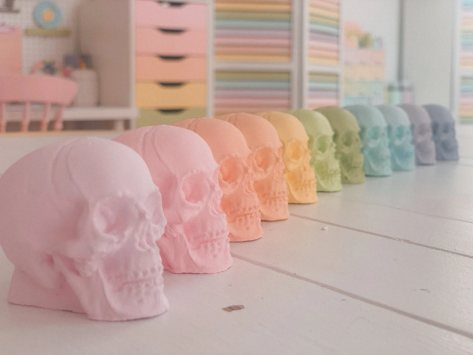 These pastel rainbow skulls are the perfect blend of spooky and sweet, ideal for those embracing the “Pinkoween” trend . Handcrafted with a chalky finish, they add a whimsical touch to your Halloween decor. Whether displayed on a tiered tray, nestled