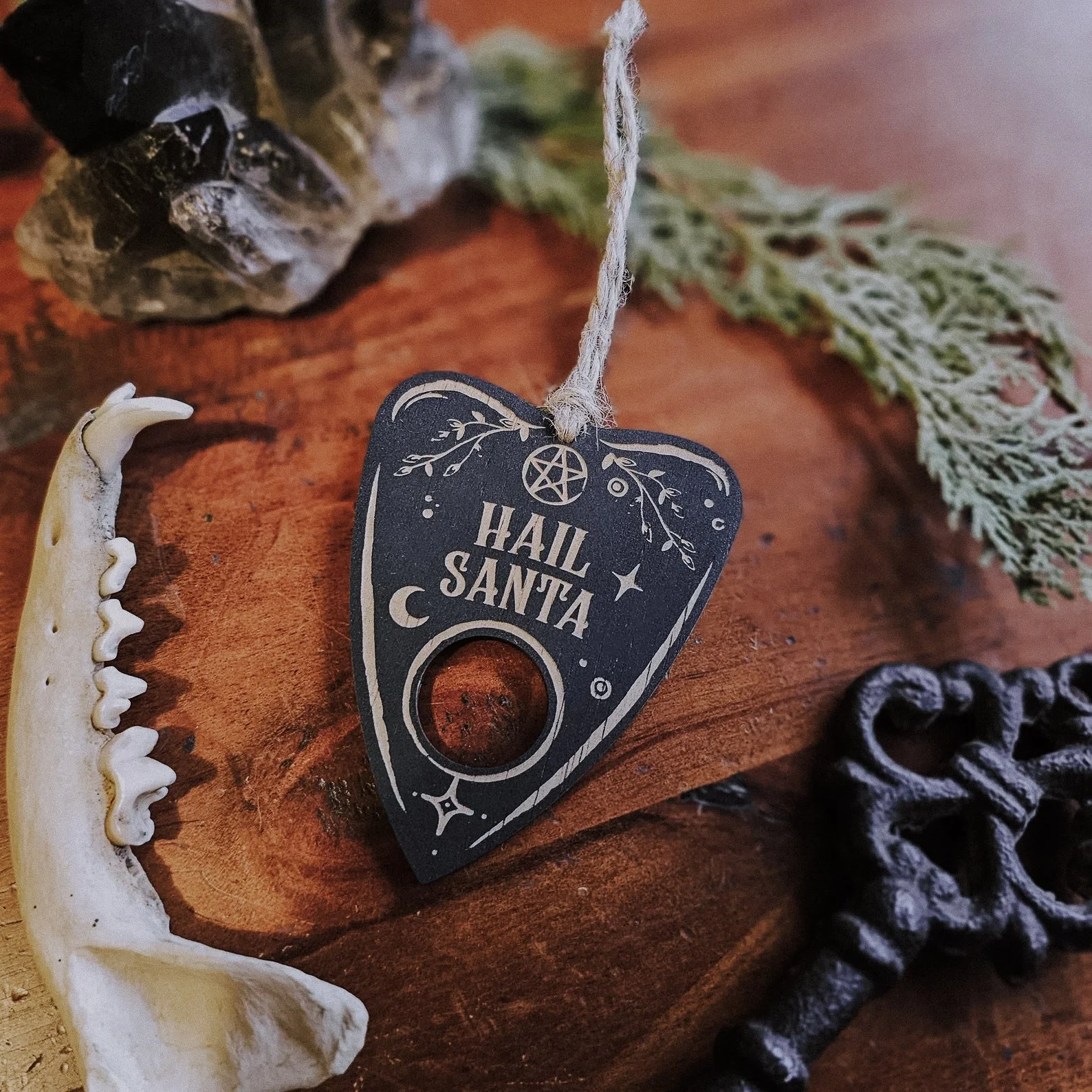 Glossy black bauble that cheekily says “Hail Santa,” blending satanic parody with holiday sparkle, perfect for dark humor lovers.