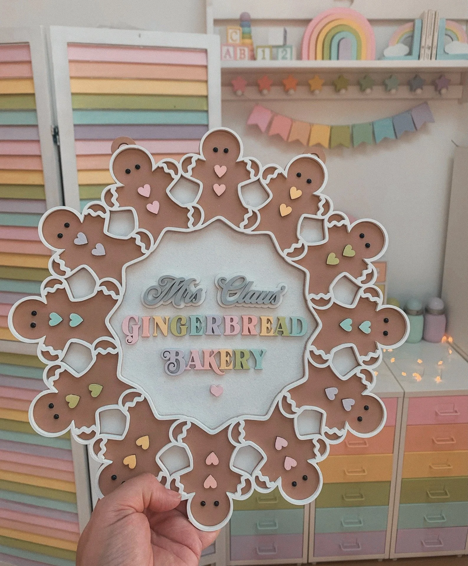This gingerbread wreath from Etsy is a delightful addition to any holiday decor, blending festive charm with a touch of whimsy. Handcrafted with attention to detail, it features adorable gingerbread figures and vibrant accents that capture the essenc