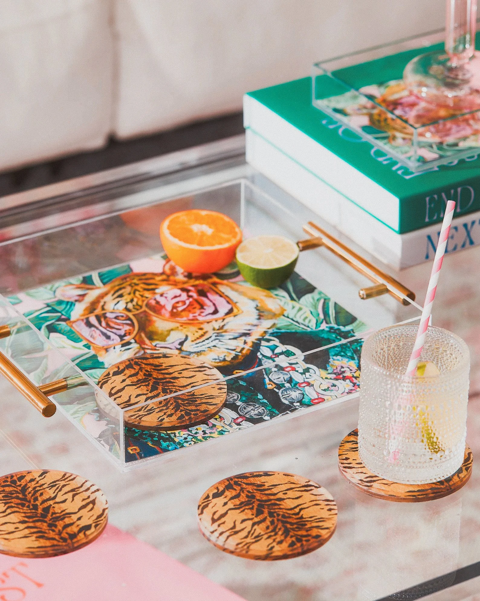Bold acrylic tray with a fashionable tiger print and gold handles, ideal for chic storage, vanity flair, or serving in wild style.