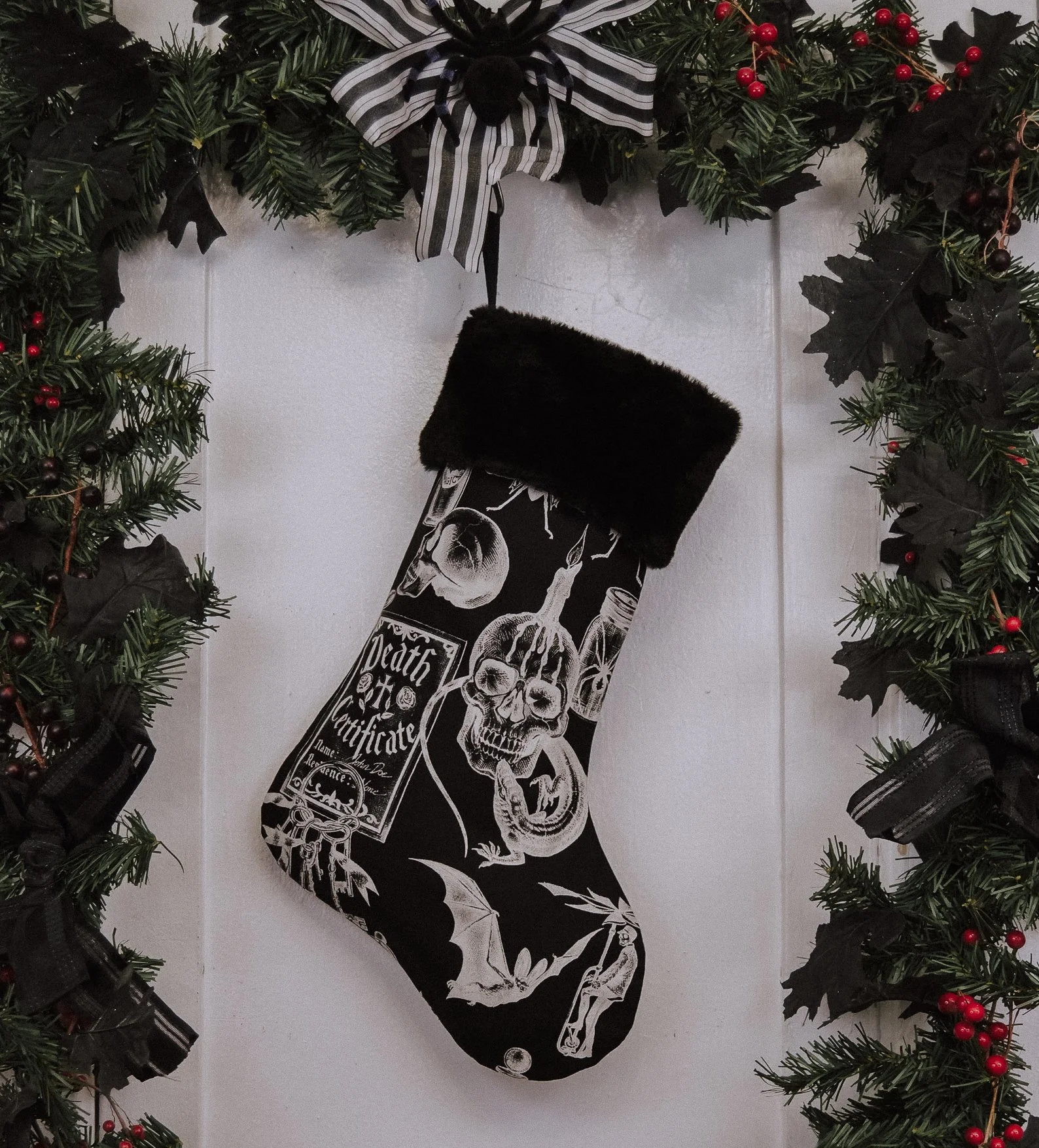 Black velvet stocking embroidered with arcane symbols and gothic script—ready to hang in a haunted holiday hearth.