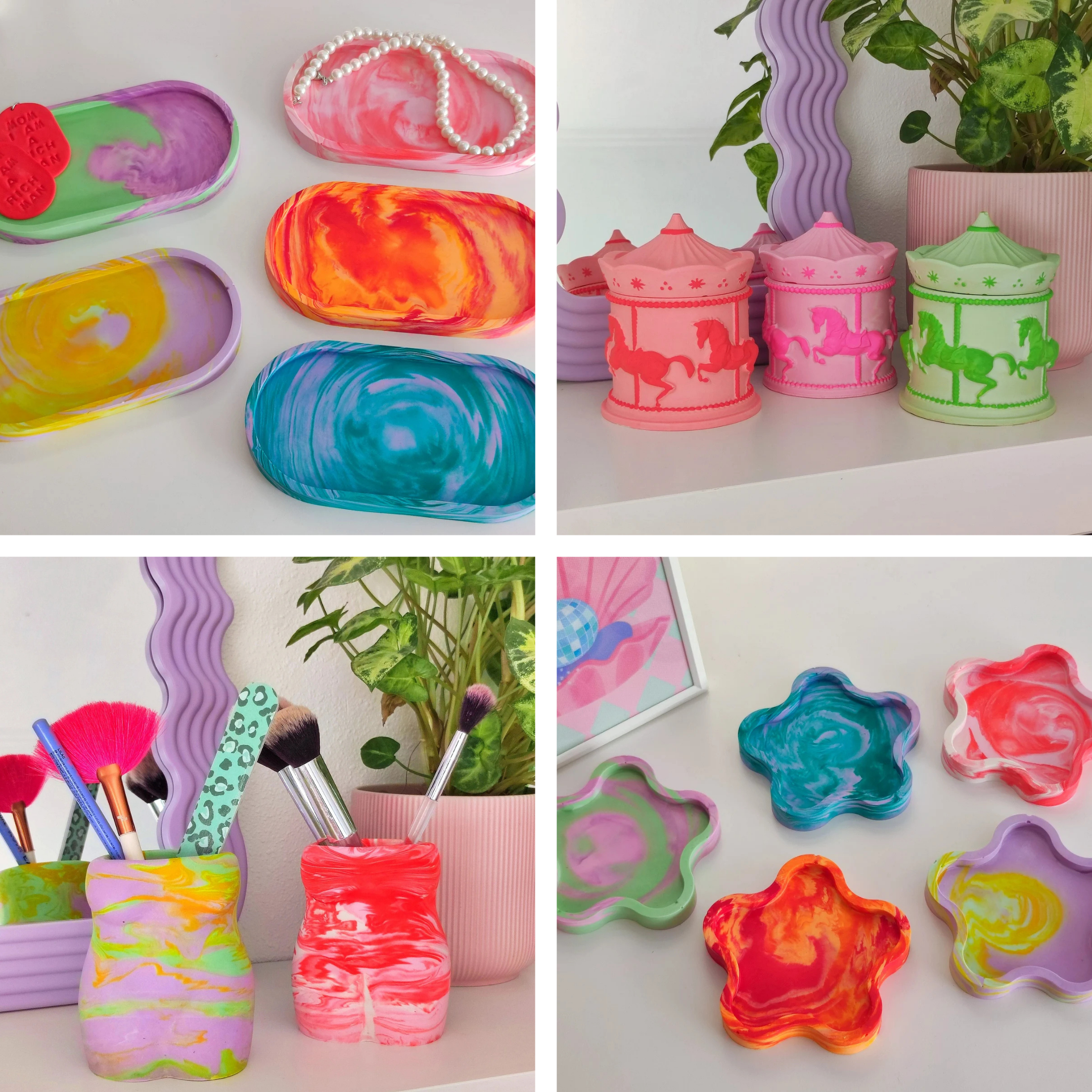 Colorful marbled trays and containers, pink carousel music boxes, makeup brushes in a marbled container, and decorative items with artificial green plants on a white surface.