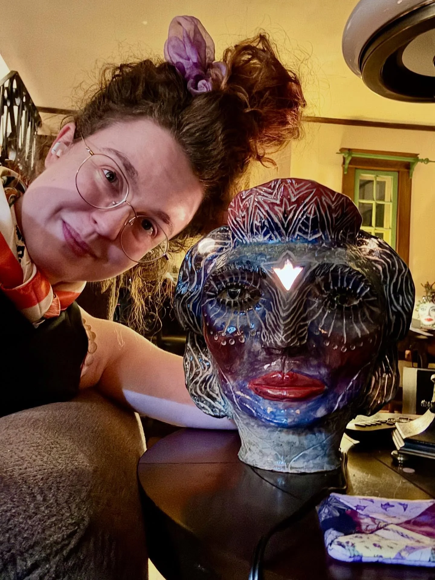 Lit up one of my favorite sculptural lamps I made today! You can find some of my pieces at the Spring Green General Store @springgreengeneralstore This one may stay with me forever. The back of her head emits the shape of a crescent moon onto the cei