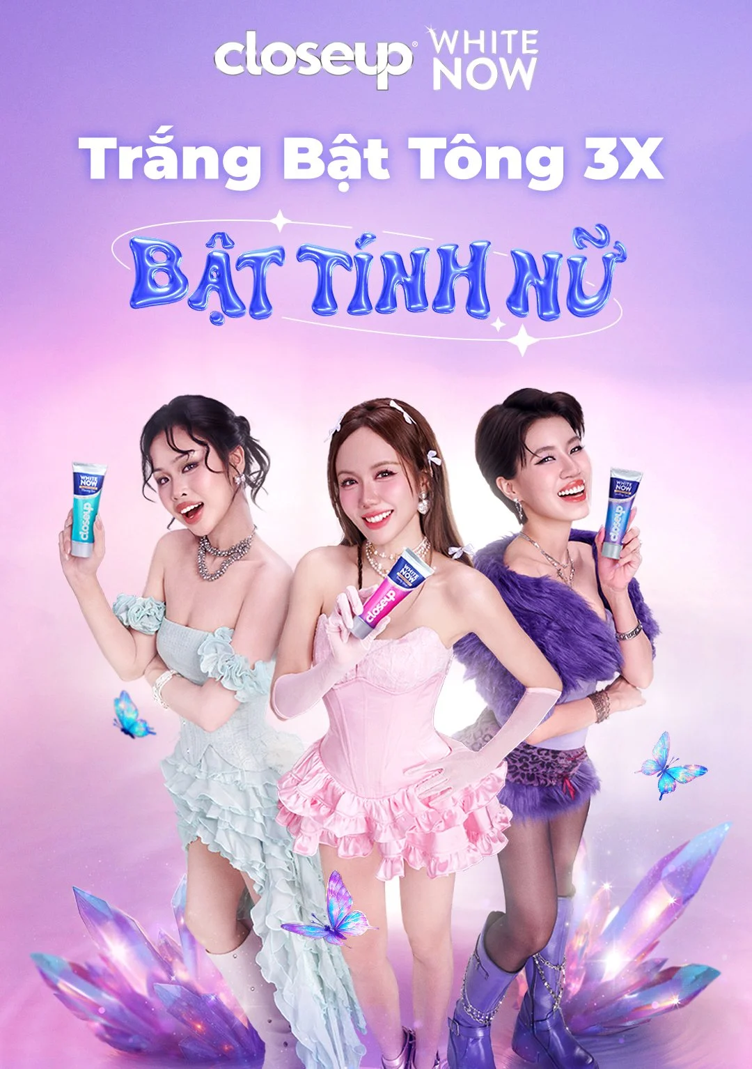 Advertisement featuring three women in colorful outfits holding Closeup toothpaste tubes, with a purple and pink fantasy background, butterflies, and glowing crystals.