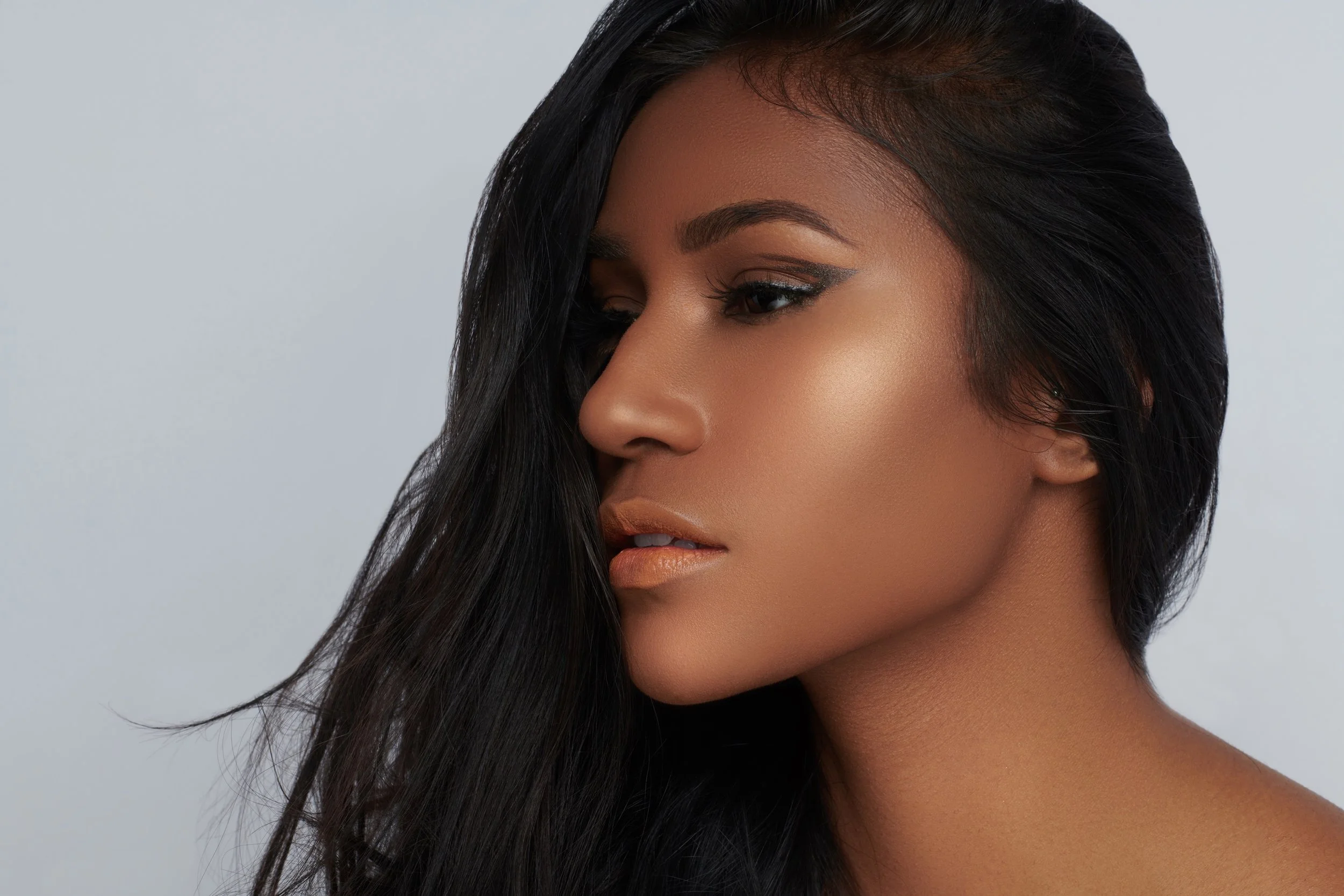 photoshoot makeup and hair with graphic liner on Indian woman