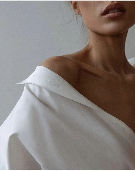 Woman in white shirt with smooth skin