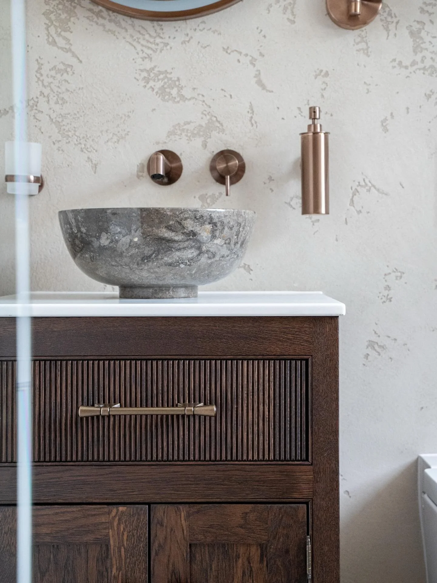 A little glimpse into a recently completed project: 
	- handcrafted stone basin ✔️
	- Rich wood vanity unit ✔️
	- Venetian walls ✔️ 
Stay tuned for the full tour. 
#InteriorDesignandbuild #Bathroomgoals #DesignDetails