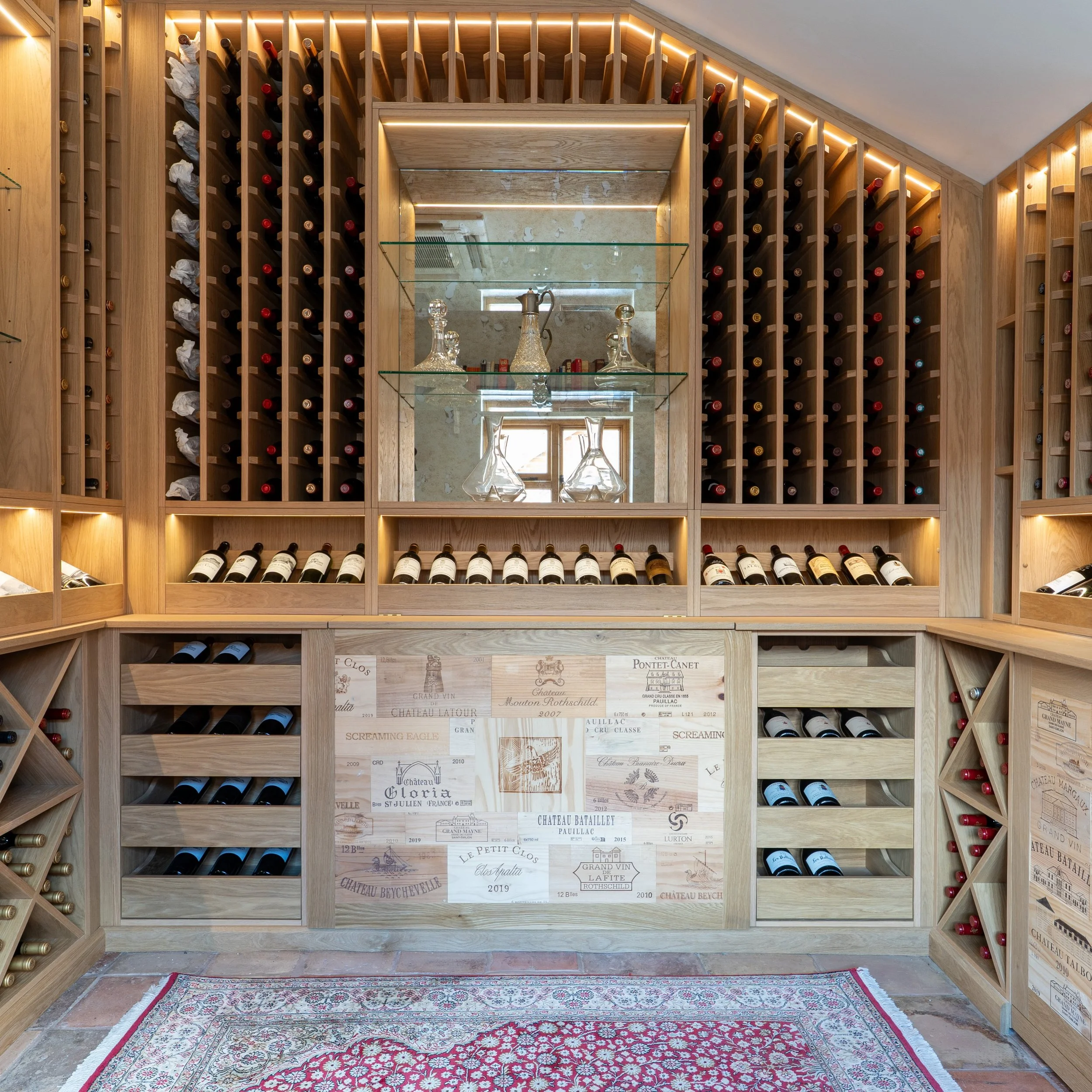 Ground floor details from the refurbished areas of the original house at our Lavenham project, featuring a bespoke wine room with a dedicated low-temperature cooling system that maintains the room at a consistent 12&deg;C. 

Other details include, ca