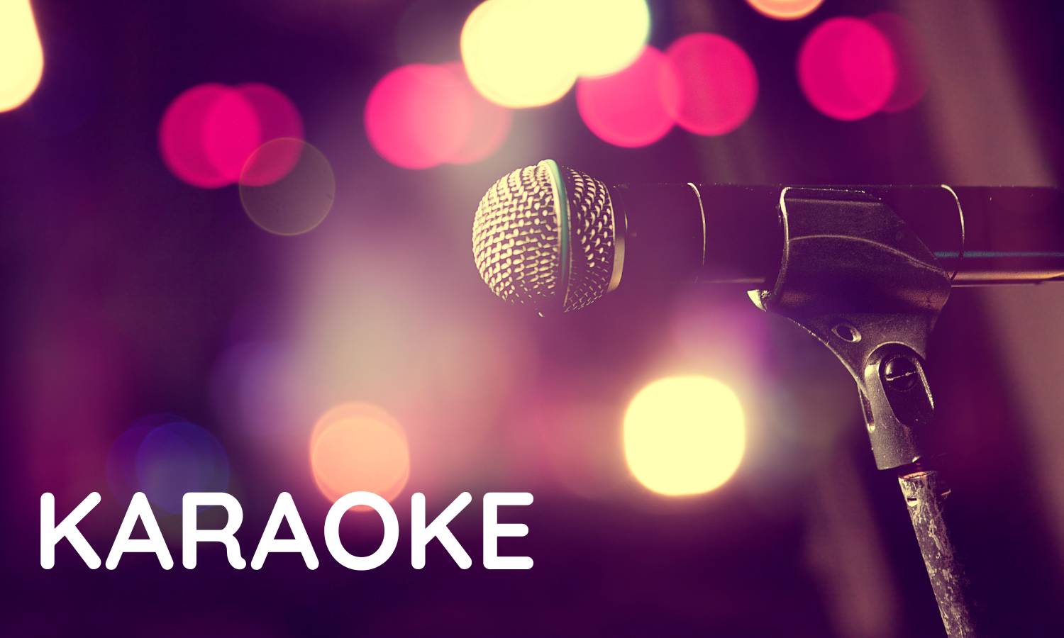 A microphone on a stand with colorful blurred lights in the background, with the word 'KARAOKE' in large white letters at the bottom left.