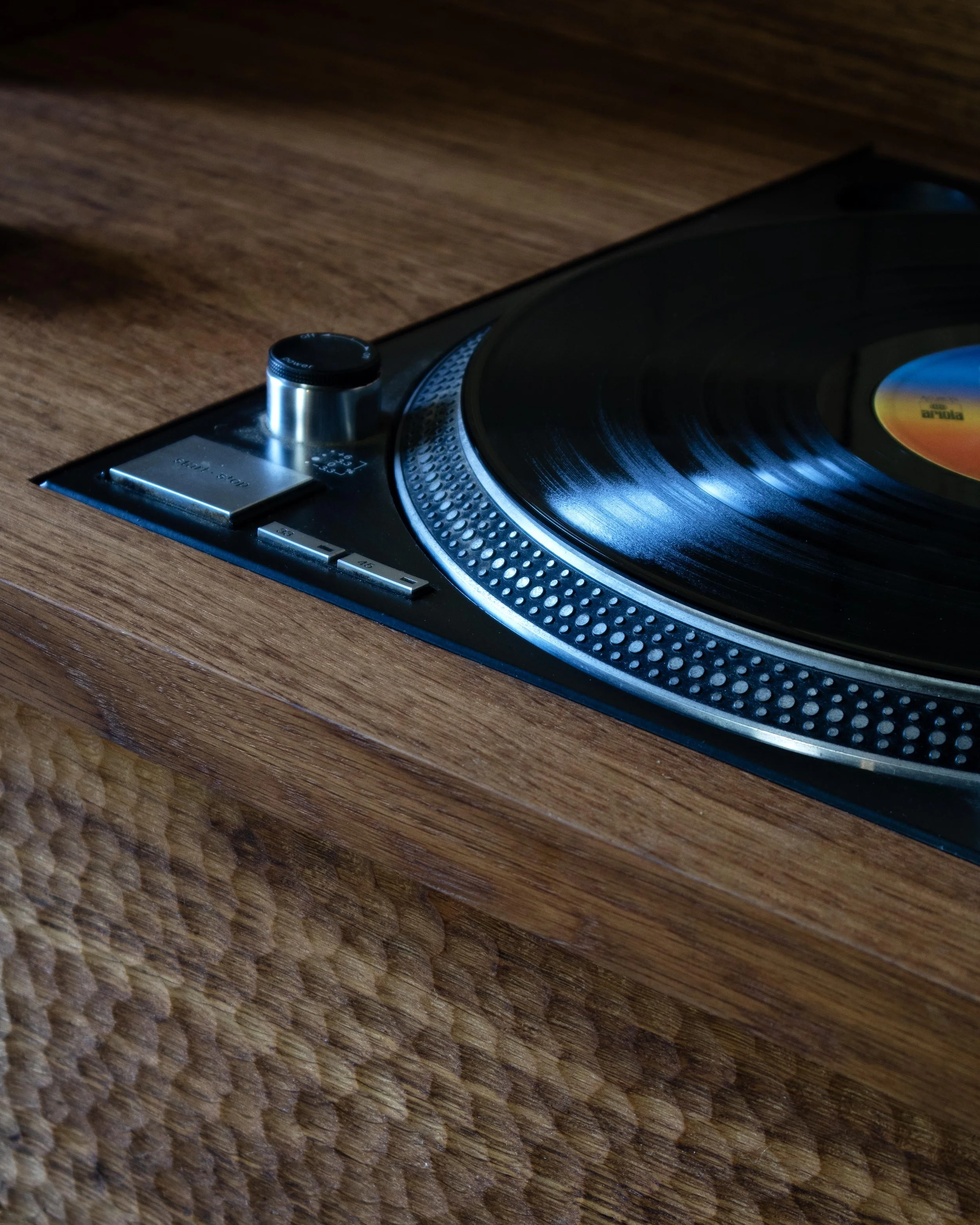 Handcrafted solid wood record cabinet made from British-grown brown oak and ash, featuring chip-carved drawers and woven ash detailing